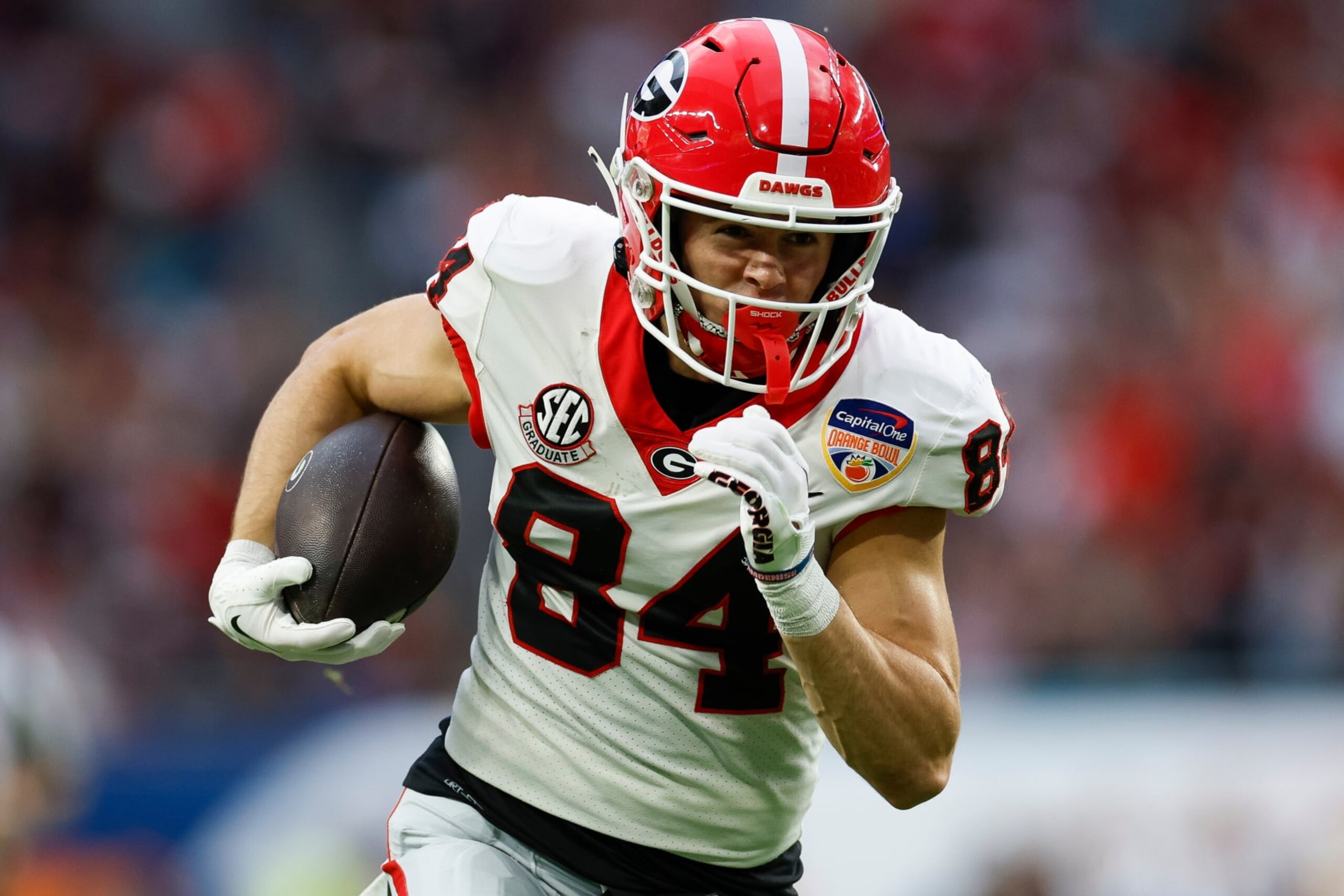 MIAMI GARDENS, FLORIDA - DECEMBER 30: Ladd McConkey #84 of the Georgia Bulldogs runs for a touchdown in the first half against the Florida State Seminoles during the Capital One Orange Bowl at Hard Rock Stadium on December 30, 2023 in Miami Gardens, Florida. (Photo by Brandon Sloter/Image Of Sport/Getty Images)
