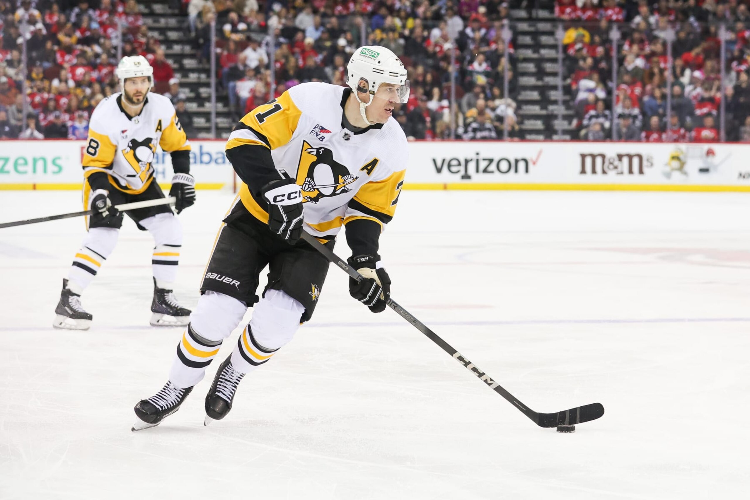 NEWARK, NJ - APRIL 02: Pittsburgh Penguins center Evgeni Malkin (71) skates with the puck during a game between the Pittsburgh Penguins and New Jersey Devils on April 2, 2024 at Prudential Center in the Newark, New Jersey. (Photo by Andrew Mordzynski/Icon Sportswire via Getty Images)