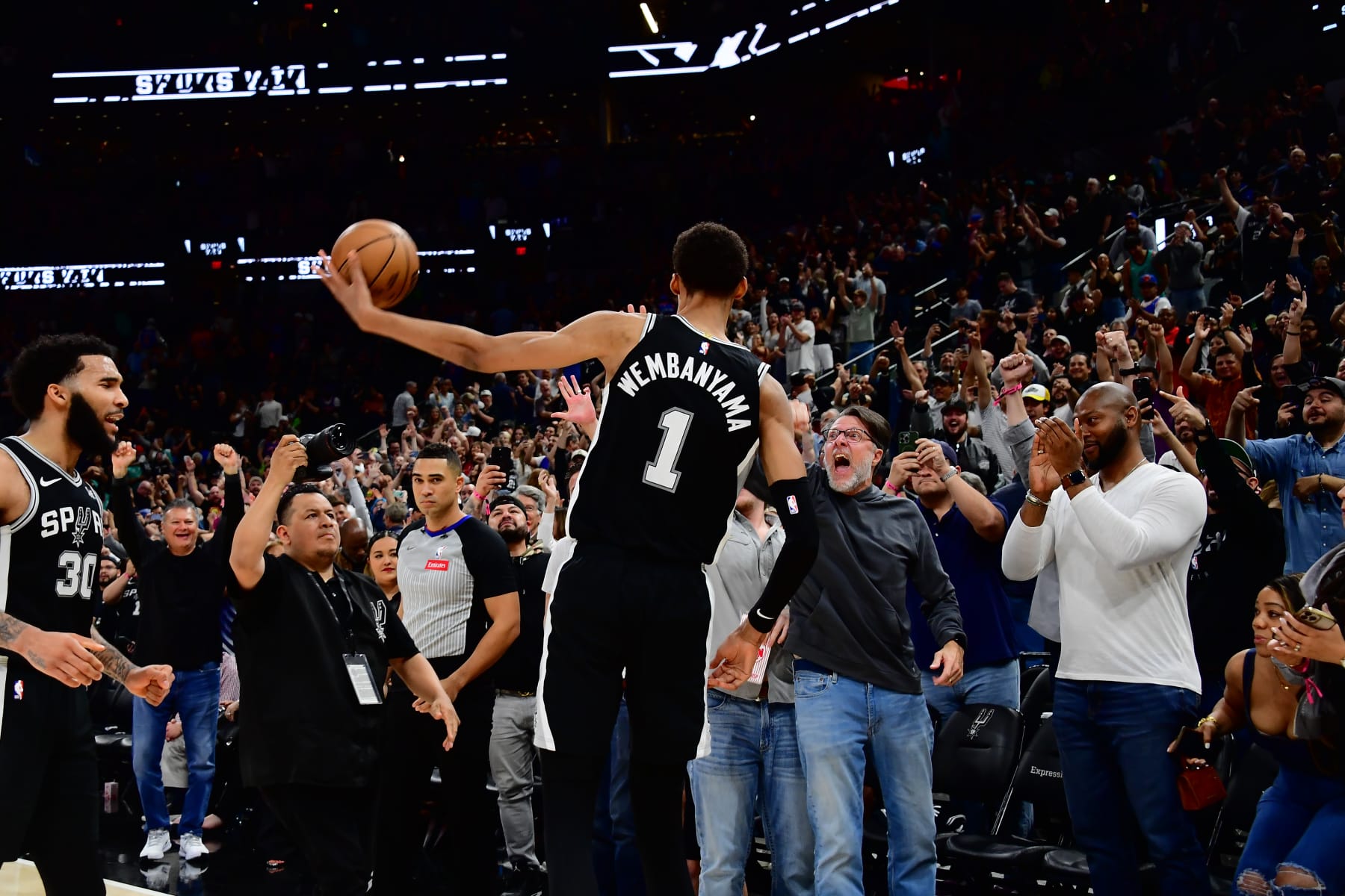 SAN ANTONIO, TX - MARCH 29: Victor Wembanyama #1 of the San Antonio Spurs throws the ball to fans after the game against the New York Knicks on March 29, 2024 at the Frost Bank Center in San Antonio, Texas. NOTE TO USER: User expressly acknowledges and agrees that, by downloading and or using this photograph, user is consenting to the terms and conditions of the Getty Images License Agreement. Mandatory Copyright Notice: Copyright 2024 NBAE (Photos by Michael Gonzales/NBAE via Getty Images)