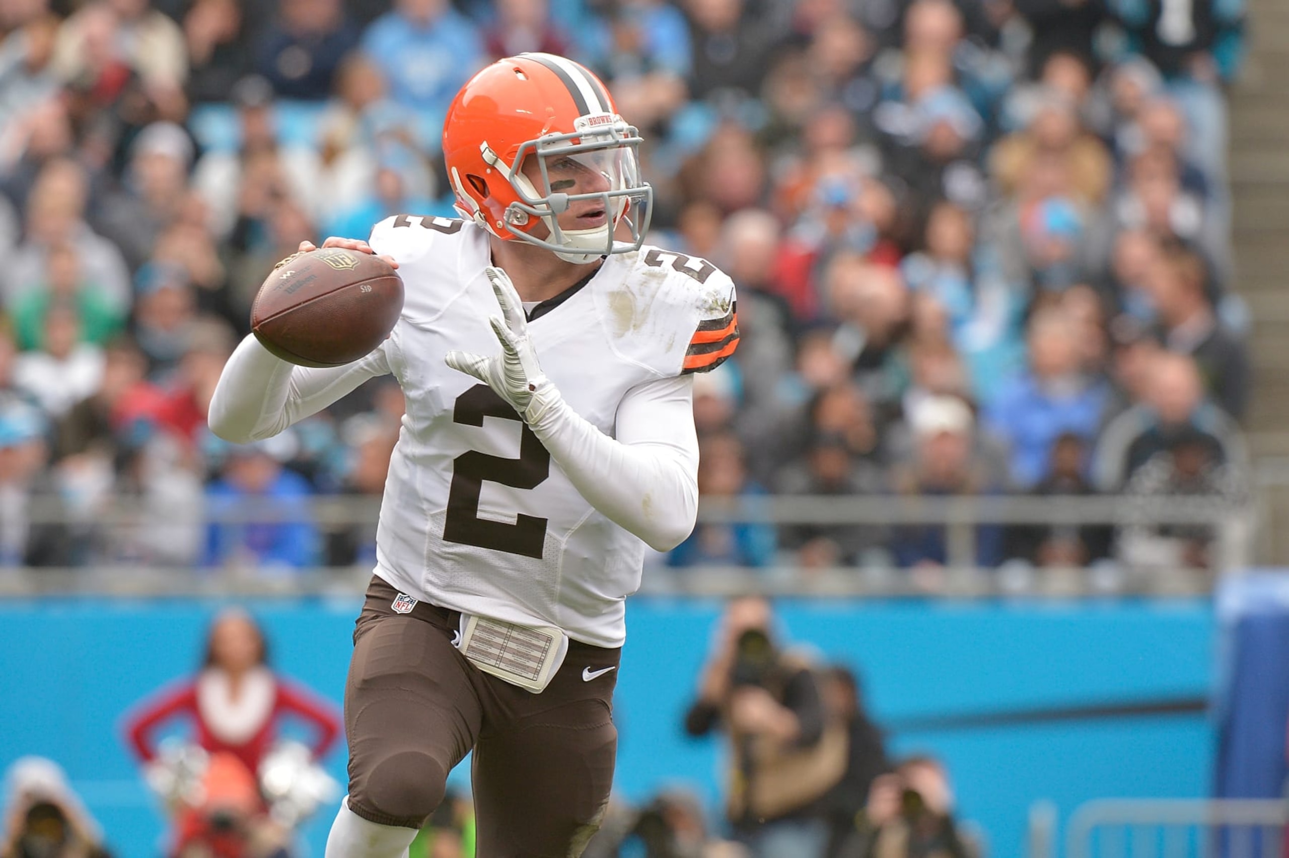 CHARLOTTE, NC - DECEMBER 21:  Johnny Manziel #2 of the Cleveland Browns rolls out against the Carolina Panthers during their game at Bank of America Stadium on December 21, 2014 in Charlotte, North Carolina. The Panthers won 17-13.  (Photo by Grant Halverson/Getty Images)