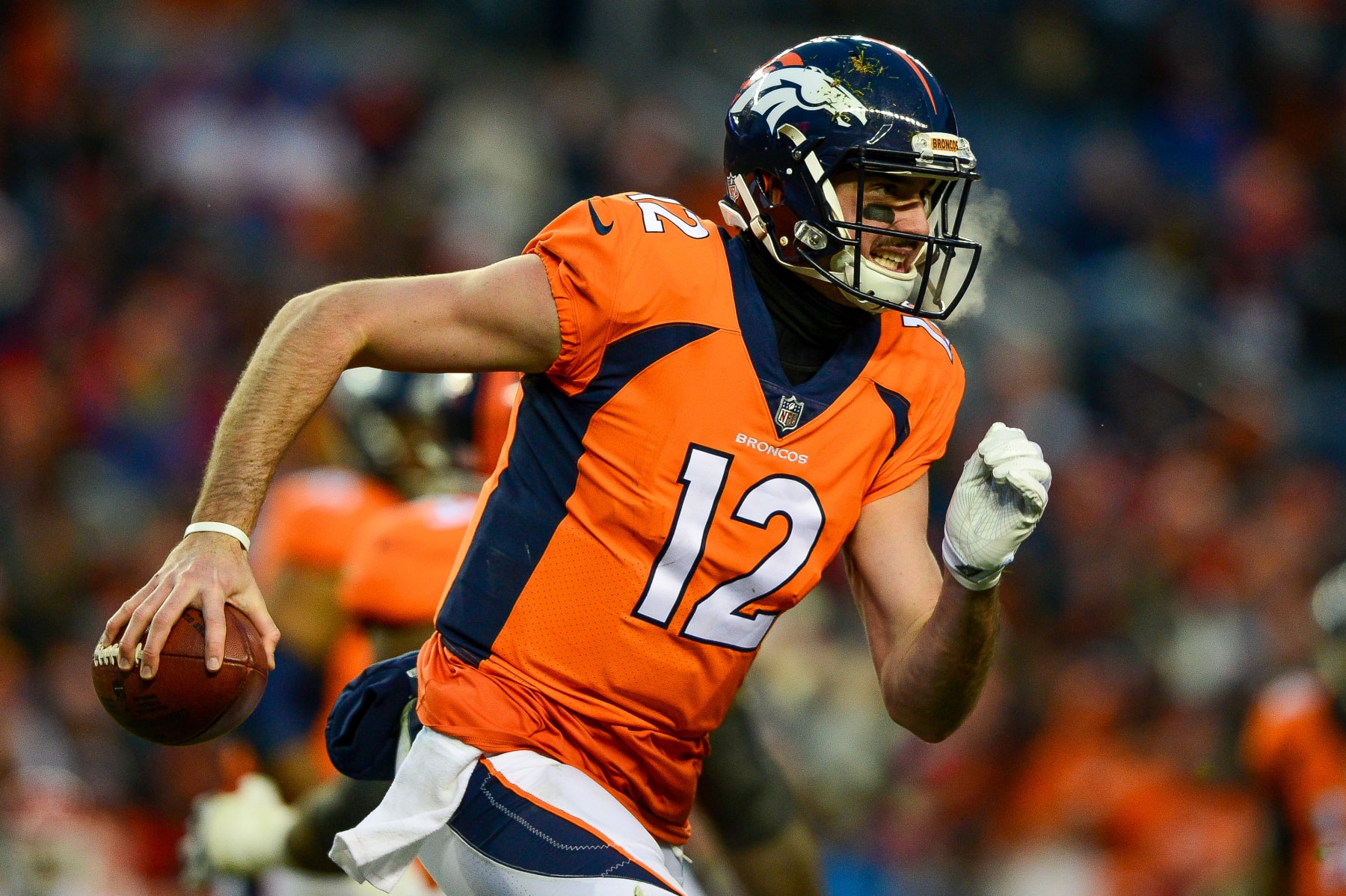 DENVER, CO - DECEMBER 31:  Quarterback Paxton Lynch #12 of the Denver Broncos scrambles against the Kansas City Chiefs at Sports Authority Field at Mile High on December 31, 2017 in Denver, Colorado. (Photo by Dustin Bradford/Getty Images)
