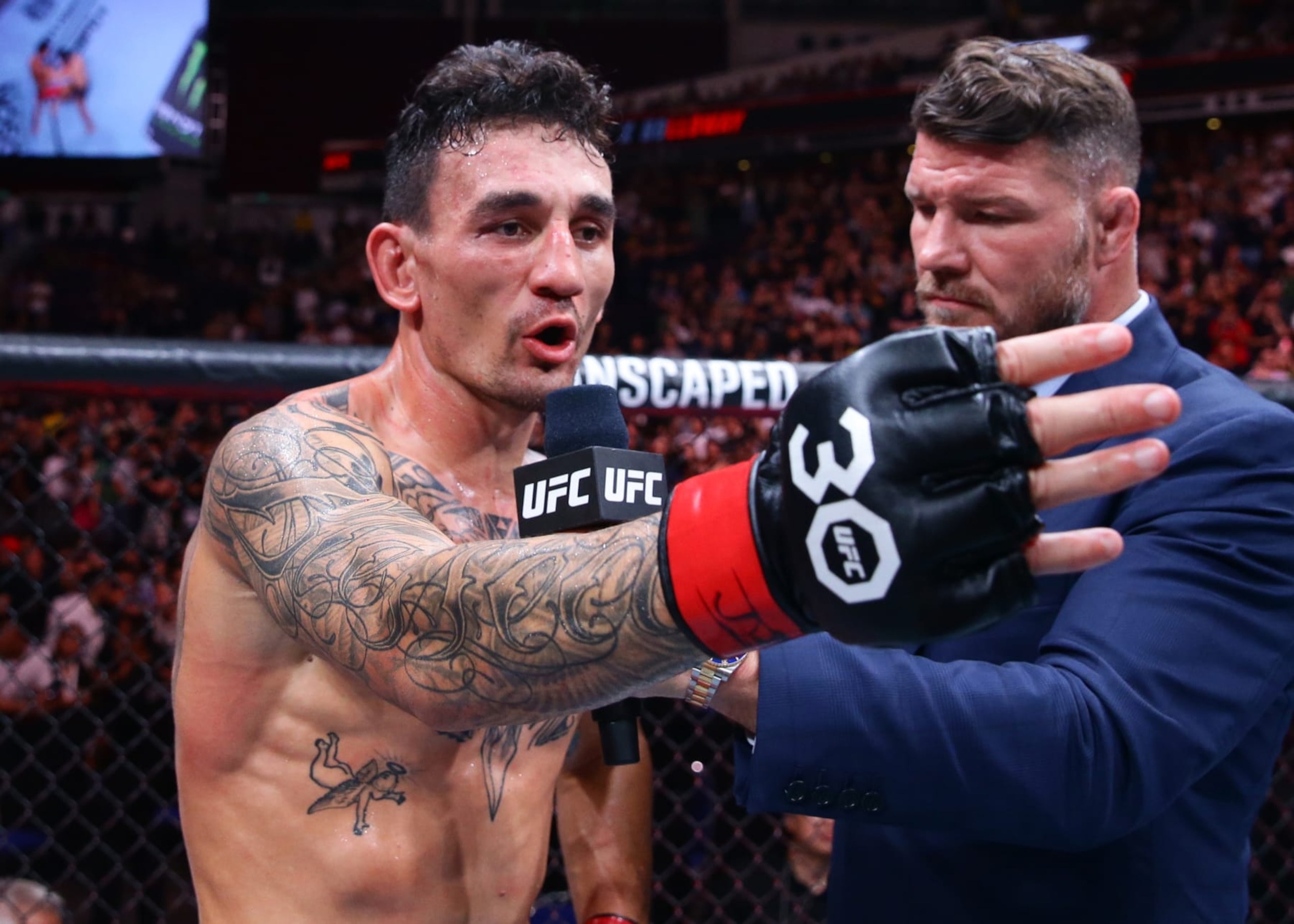 Max Holloway reacts after his knockout victory over Chan Sung Jung