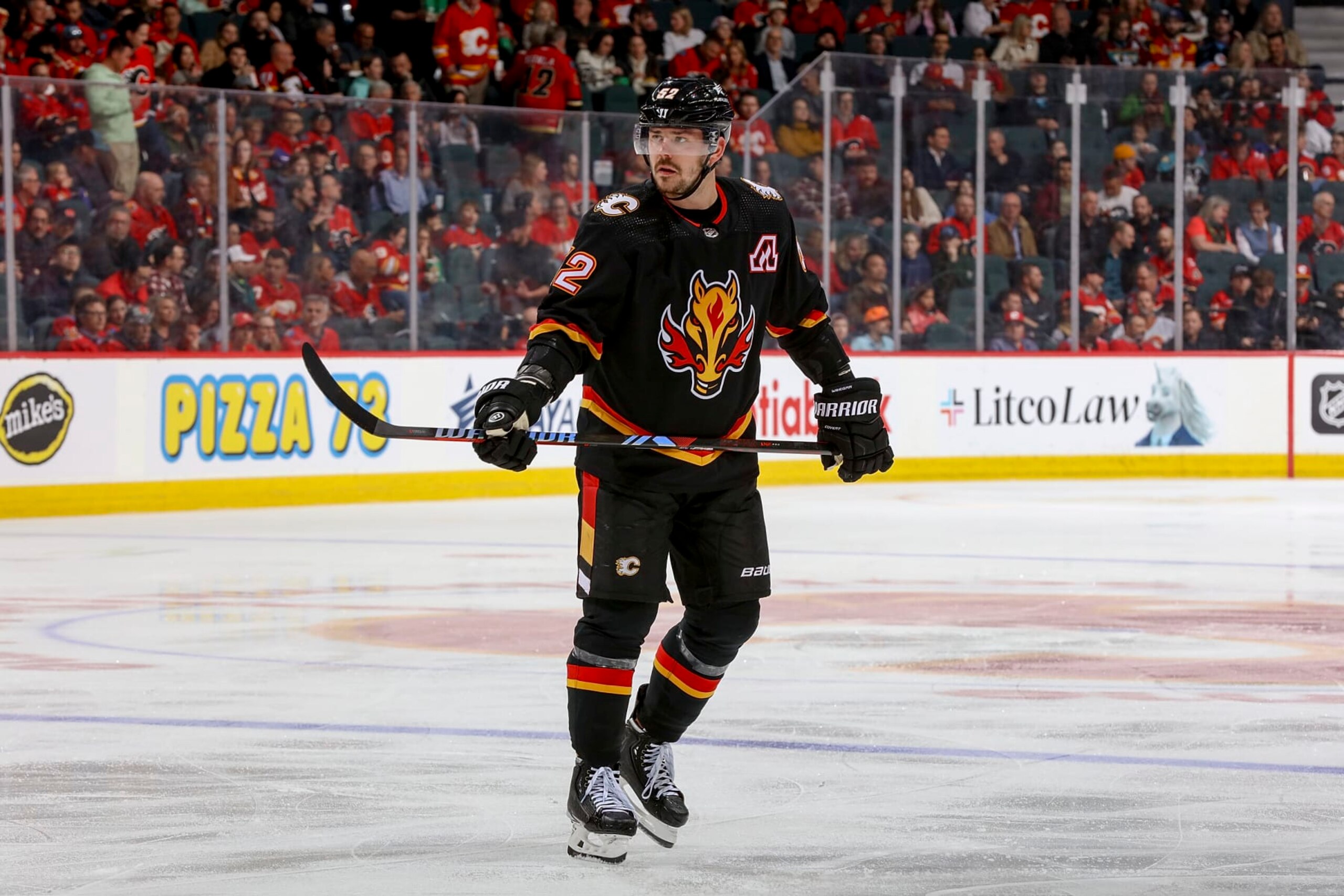 CALGARY, AB - APRIL 2: MacKenzie Weegar #52 of the Calgary Flames skates up ice against the Anaheim Ducks at Scotiabank Saddledome on April 2, 2024 in Calgary, Alberta, Canada. (Photo by Gerry Thomas/NHLI via Getty Images)