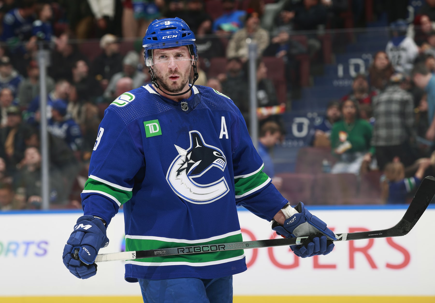 VANCOUVER, CANADA - JANUARY 18: J.T. Miller #9 of the Vancouver Canucks skates up ice during their NHL game against the Arizona Coyotes at Rogers Arena on January 18, 2024 in Vancouver, British Columbia, Canada.  (Photo by Jeff Vinnick/NHLI via Getty Images)