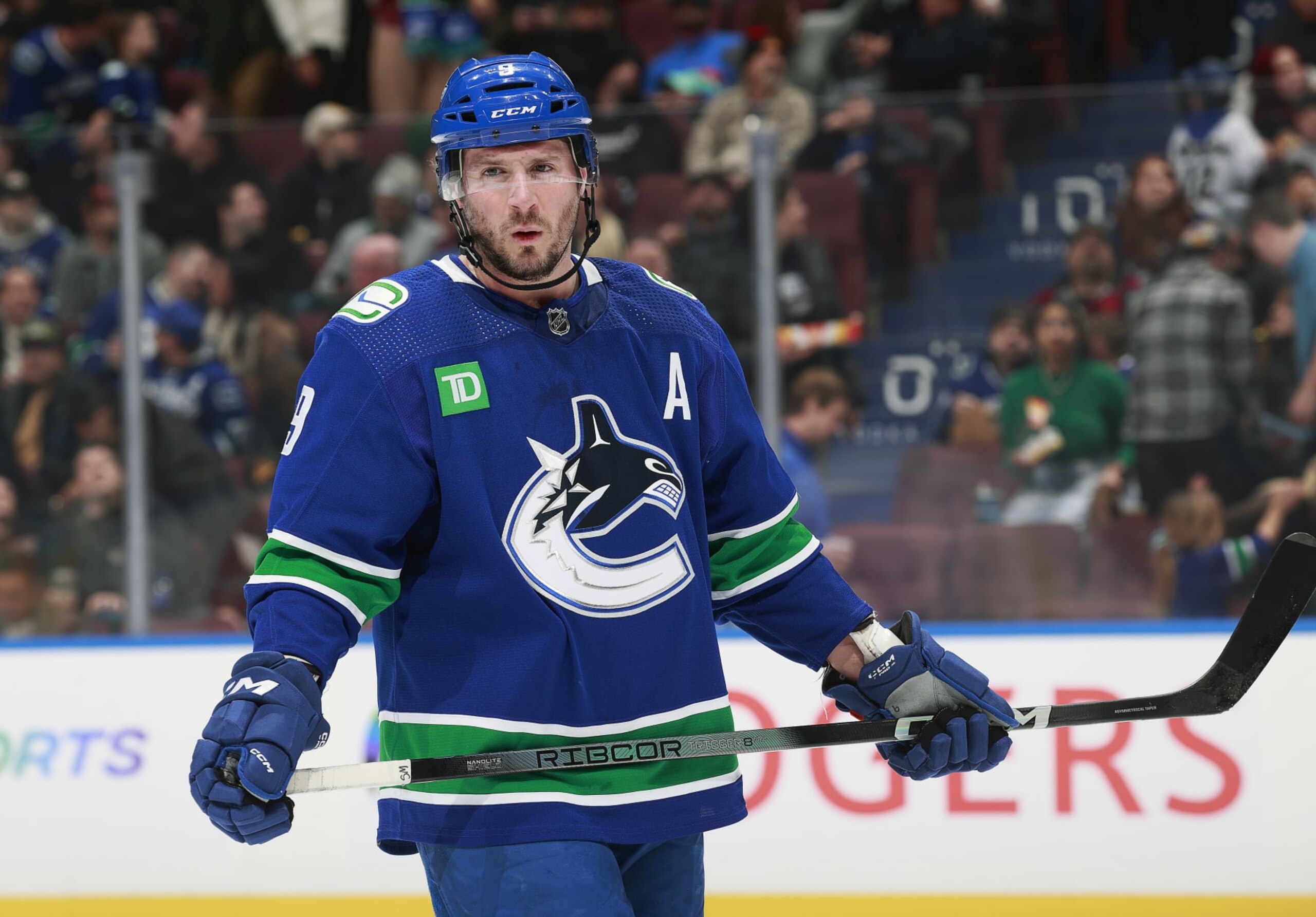 VANCOUVER, CANADA - JANUARY 18: J.T. Miller #9 of the Vancouver Canucks skates up ice during their NHL game against the Arizona Coyotes at Rogers Arena on January 18, 2024 in Vancouver, British Columbia, Canada.  (Photo by Jeff Vinnick/NHLI via Getty Images)
