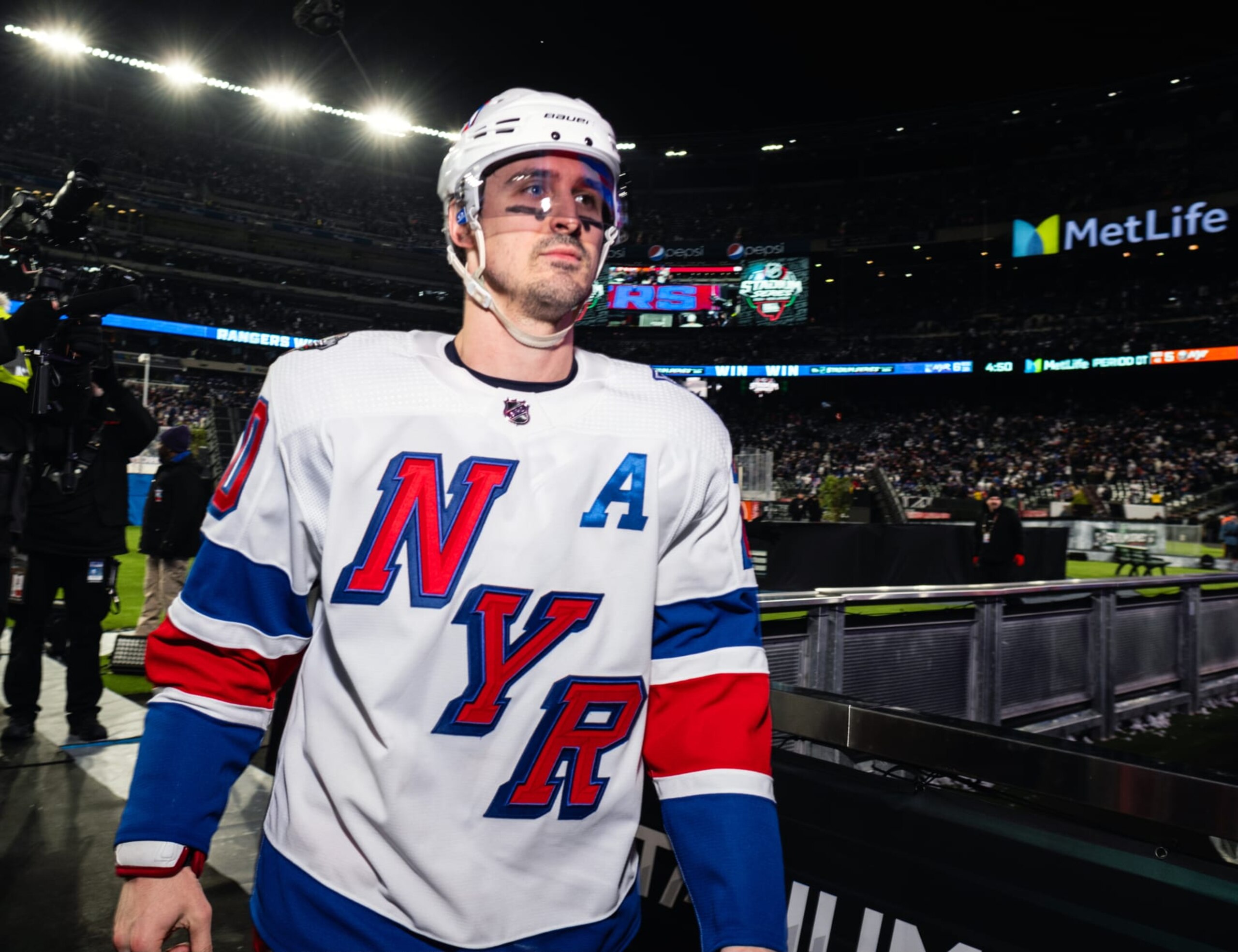 EAST RUTHERFORD, NEW JERSEY - FEBRUARY 18: Chris Kreider #20 of the New York Rangers walks off the ice after defeating the New York Islanders at MetLife Stadium on February 18, 2024 in East Rutherford, New Jersey. (Photo by Michael Mooney/NHLI via Getty Images)