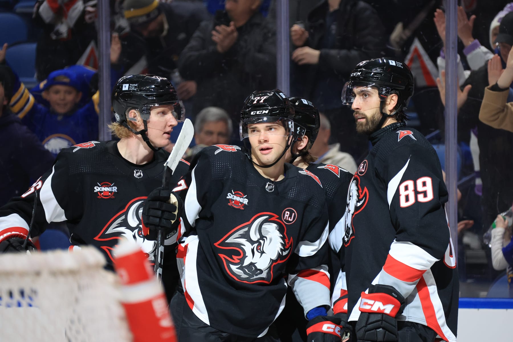 BUFFALO, NEW YORK - APRIL 2: JJ Peterka #77 of the Buffalo Sabres celebrates his first period goal against the Washington Capitals with Rasmus Dahlin #26 and Alex Tuch during an NHL game on April 2, 2024 at KeyBank Center in Buffalo, New York. (Photo by Bill Wippert/NHLI via Getty Images)