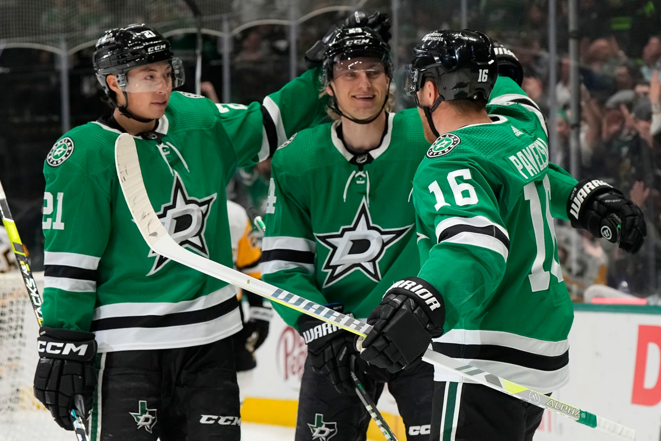 DALLAS, TEXAS - MARCH 22: Joe Pavelski #16 of the Dallas Stars is congratulated by Jason Robertson #21 and Roope Hintz #24 after scoring a goal during the first period against the Pittsburgh Penguins at American Airlines Center on March 22, 2024 in Dallas, Texas. (Photo by Sam Hodde/Getty Images)