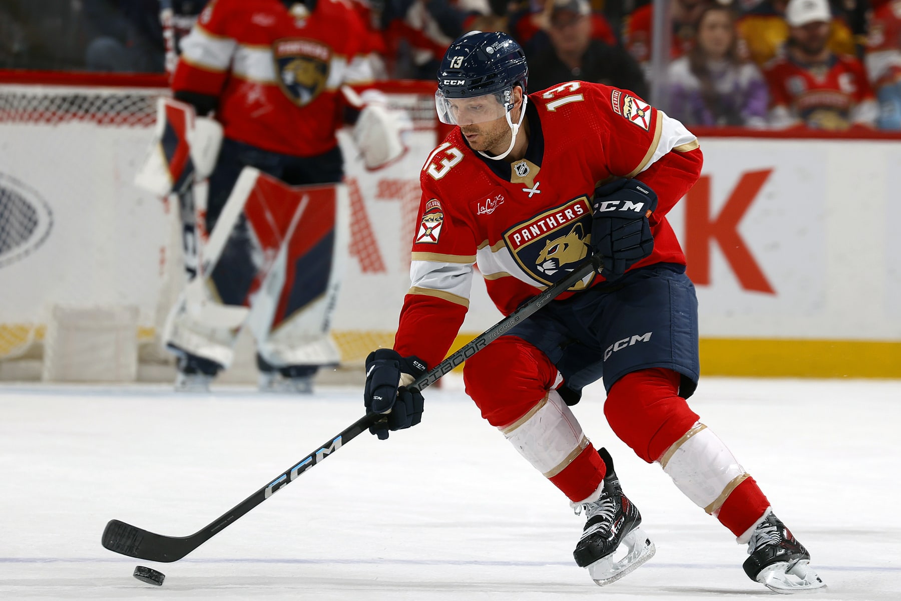 SUNRISE, FLORIDA - MARCH 26: Sam Reinhart #13 of the Florida Panthers skates with the puck during first period action against the Boston Bruins at the Amerant Bank Arena on March 26, 2024 in Sunrise, Florida. (Photo by Eliot J. Schechter/NHLI via Getty Images)