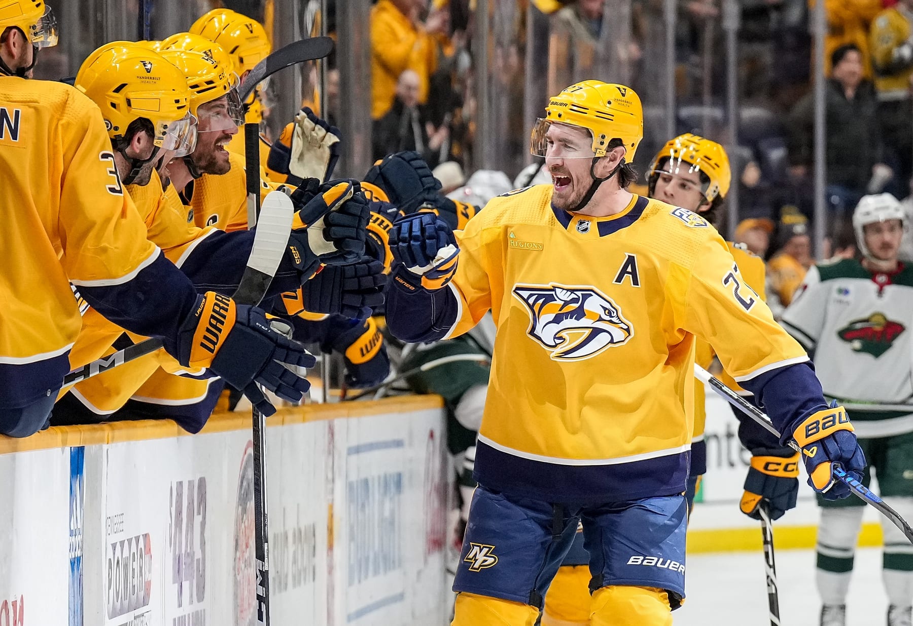 NASHVILLE, TENNESSEE - FEBRUARY 29: Ryan McDonagh #27 celebrates his goal with Roman Josi #59 of the Nashville Predators against the Minnesota Wild during an NHL game at Bridgestone Arena on February 29, 2024 in Nashville, Tennessee. (Photo by John Russell/NHLI via Getty Images)