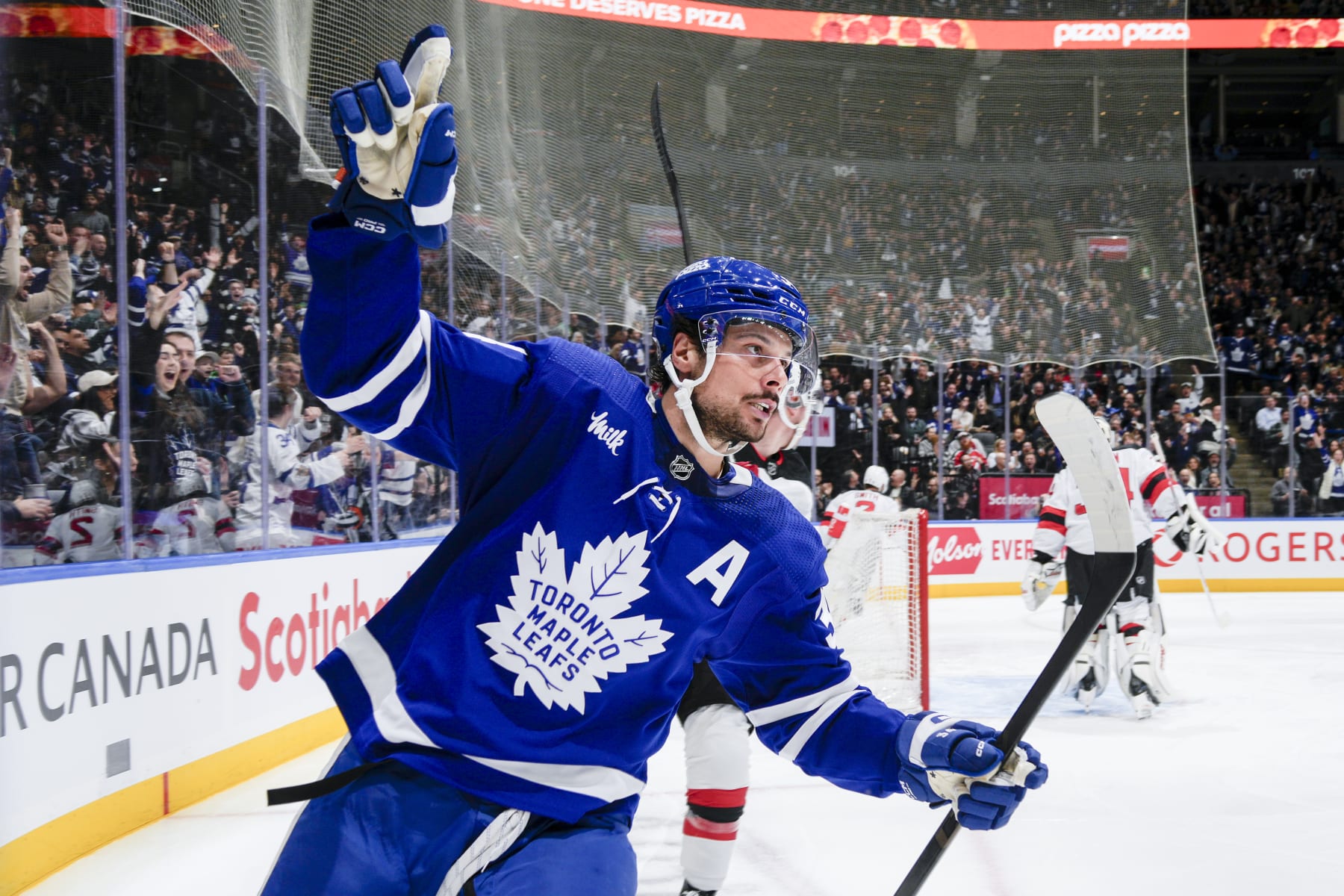 TORONTO, ON - MARCH 26: Auston Matthews #34 of the Toronto Maple Leafs celebrates his goal against the New Jersey Devils during the second period at Scotiabank Arena on March 26, 2024 in Toronto, Ontario, Canada. (Photo by Kevin Sousa/NHLI via Getty Images)