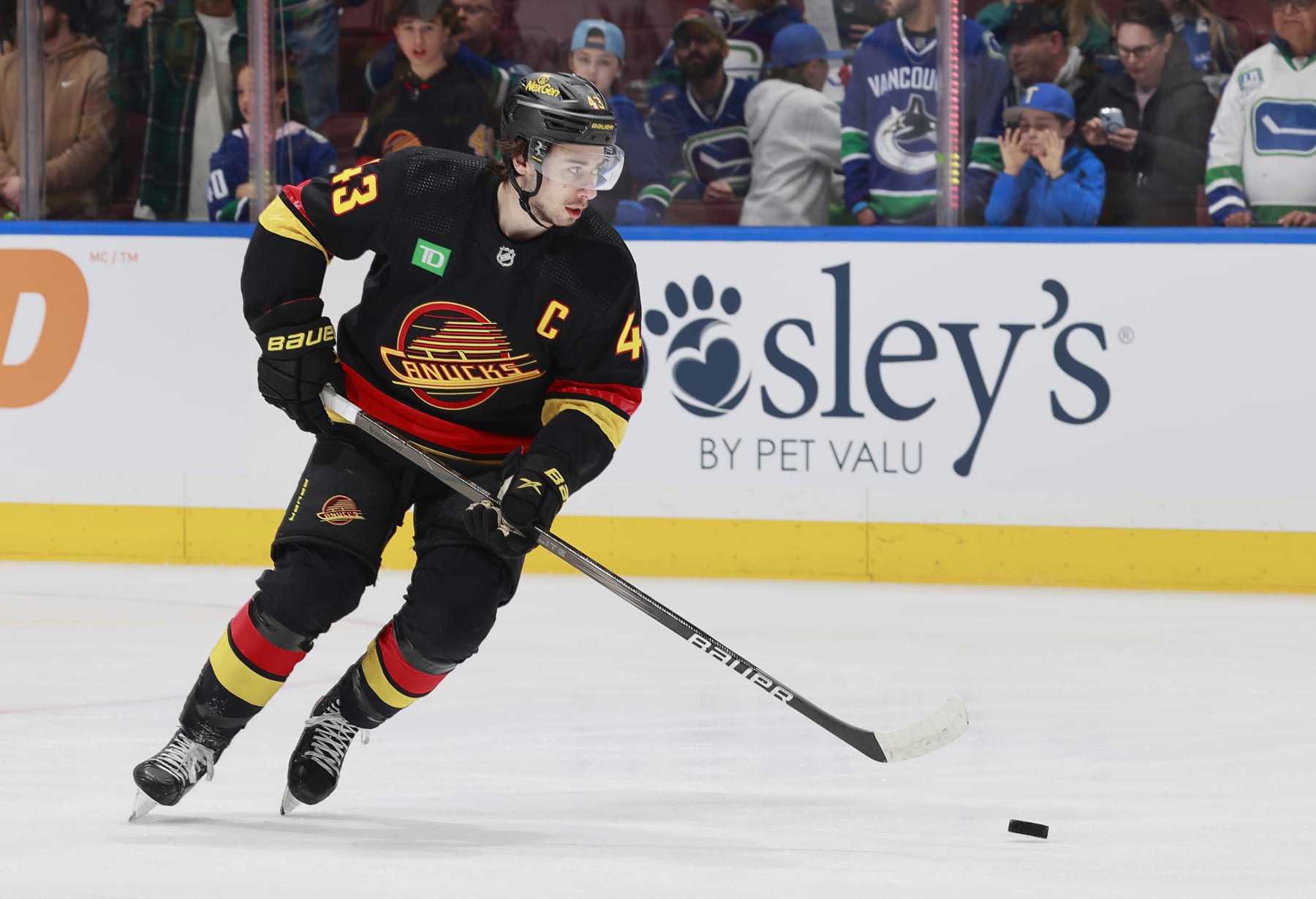 VANCOUVER, CANADA - MARCH 28: Quinn Hughes #43 of the Vancouver Canucks skates up ice during their NHL game against the Dallas Stars at Rogers Arena on March 28, 2024 in Vancouver, British Columbia, Canada.  (Photo by Jeff Vinnick/NHLI via Getty Images)