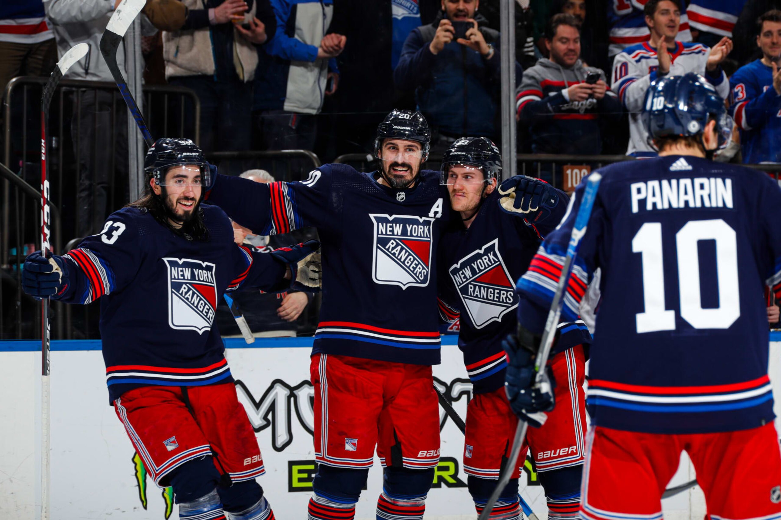 NEW YORK, NEW YORK - APRIL 03:  Chris Kreider #20 of the New York Rangers celebrates with teammates after scoring a goal in the third period against the New Jersey Devils at Madison Square Garden on April 3, 2024 in New York City. (Photo by Jared Silber/NHLI via Getty Images)