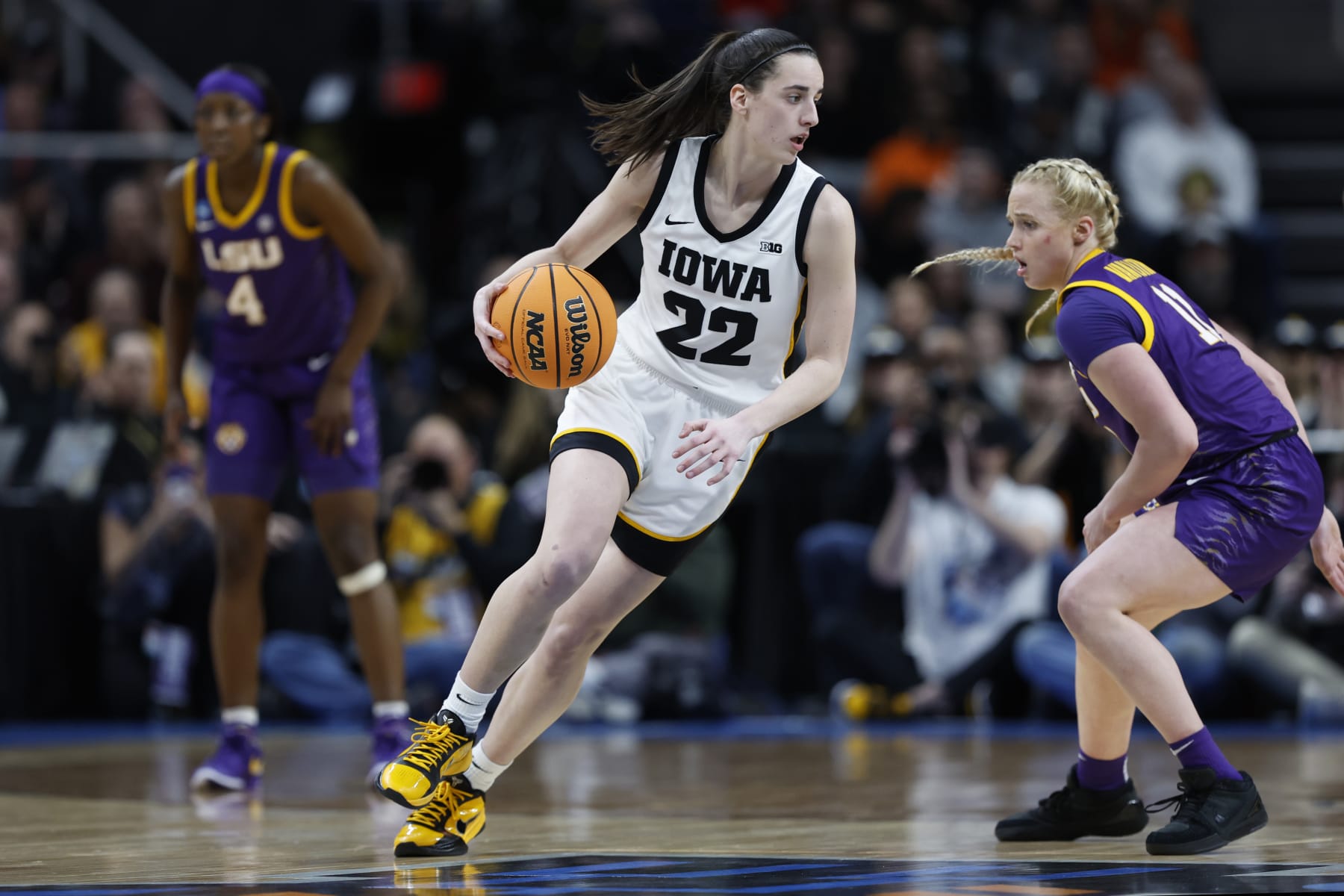 ALBANY, NEW YORK - APRIL 01: Caitlin Clark #22 of the Iowa Hawkeyes dribbles against Hailey Van Lith #11 of the LSU Tigers during the second half in the Elite 8 round of the NCAA Women's Basketball Tournament at MVP Arena on April 01, 2024 in Albany, New York. (Photo by Sarah Stier/Getty Images)