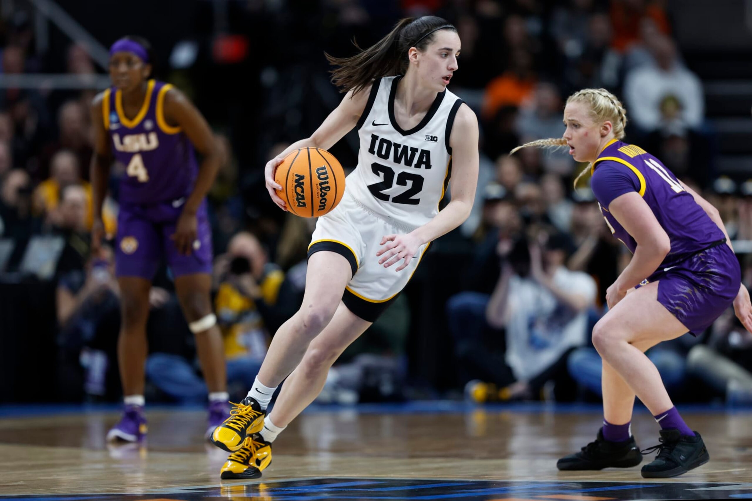 ALBANY, NEW YORK - APRIL 01: Caitlin Clark #22 of the Iowa Hawkeyes dribbles against Hailey Van Lith #11 of the LSU Tigers during the second half in the Elite 8 round of the NCAA Women's Basketball Tournament at MVP Arena on April 01, 2024 in Albany, New York. (Photo by Sarah Stier/Getty Images)