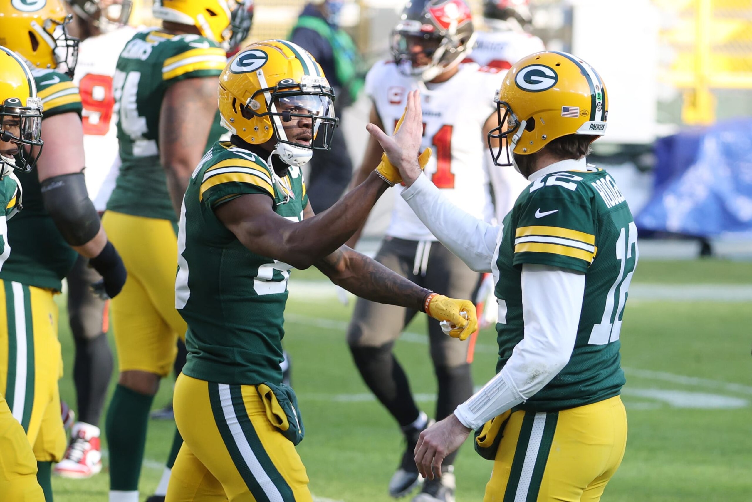GREEN BAY, WISCONSIN - JANUARY 24: Marquez Valdes-Scantling #83 celebrates his touchdown reception with Aaron Rodgers #12 of the Green Bay Packers in the second quarter against the Tampa Bay Buccaneers during the NFC Championship game at Lambeau Field on January 24, 2021 in Green Bay, Wisconsin. (Photo by Dylan Buell/Getty Images) GREEN BAY, WISCONSIN - JANUARY 24: Marquez Valdes-Scantling #83 celebrates his touchdown reception with Aaron Rodgers #12 of the Green Bay Packers in the second quarter against the Tampa Bay Buccaneers during the NFC Championship game at Lambeau Field on January 24, 2021 in Green Bay, Wisconsin. (Photo by Dylan Buell/Getty Images)