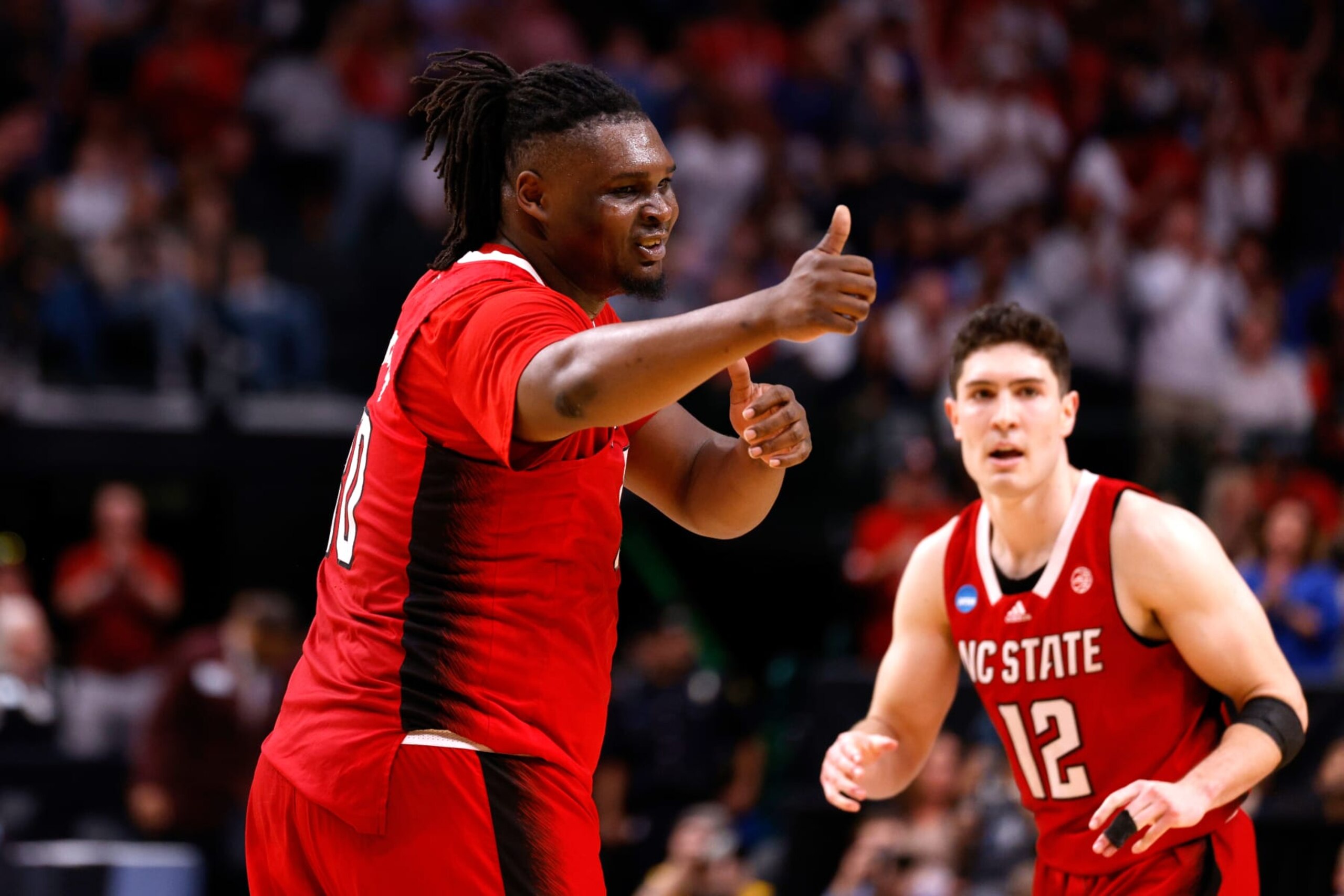 DALLAS, TEXAS - MARCH 31: DJ Burns Jr. #30 of the NC State Wolfpack has a message for the Duke Blue Devils bench during the second half in the Elite 8 round of the NCAA Men's Basketball Tournament at American Airlines Center on March 31, 2024 in Dallas, Texas. (Photo by Lance King/Getty Images) DALLAS, TEXAS - MARCH 31: DJ Burns Jr. #30 of the NC State Wolfpack has a message for the Duke Blue Devils bench during the second half in the Elite 8 round of the NCAA Men's Basketball Tournament at American Airlines Center on March 31, 2024 in Dallas, Texas. (Photo by Lance King/Getty Images)