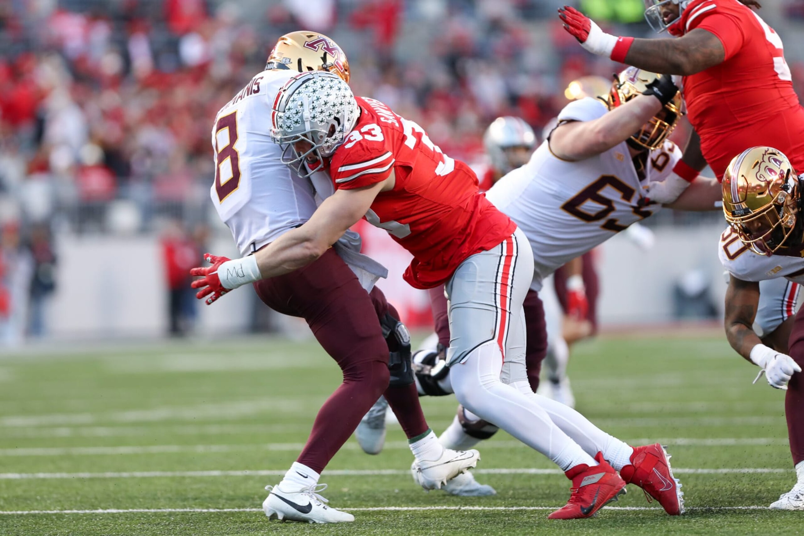 COLUMBUS, OH - NOVEMBER 18: Ohio State Buckeyes defensive end Jack Sawyer (33) tackles Minnesota Golden Gophers quarterback Athan Kaliakmanis (8) during the game against the Minnesota Gophers and the Ohio State Buckeyes on November 18, 2023, at Ohio Stadium in Columbus, OH. (Photo by Ian Johnson/Icon Sportswire via Getty Images)