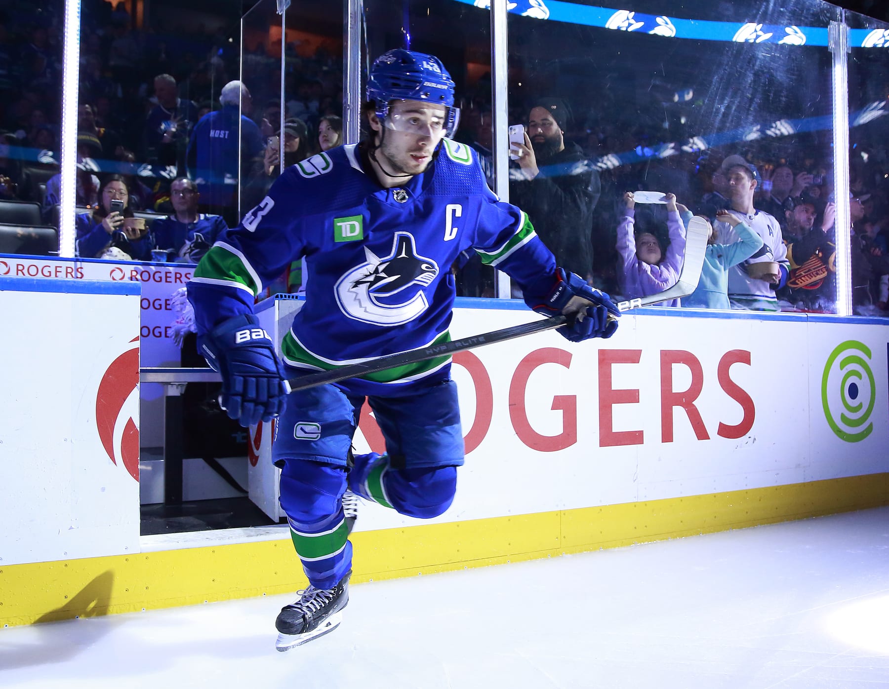 VANCOUVER, CANADA - MARCH 31: Quinn Hughes #43 of the Vancouver Canucks steps onto the ice during their NHL game against the Anaheim Ducks at Rogers Arena on March 31, 2024 in Vancouver, British Columbia, Canada.  (Photo by Jeff Vinnick/NHLI via Getty Images)