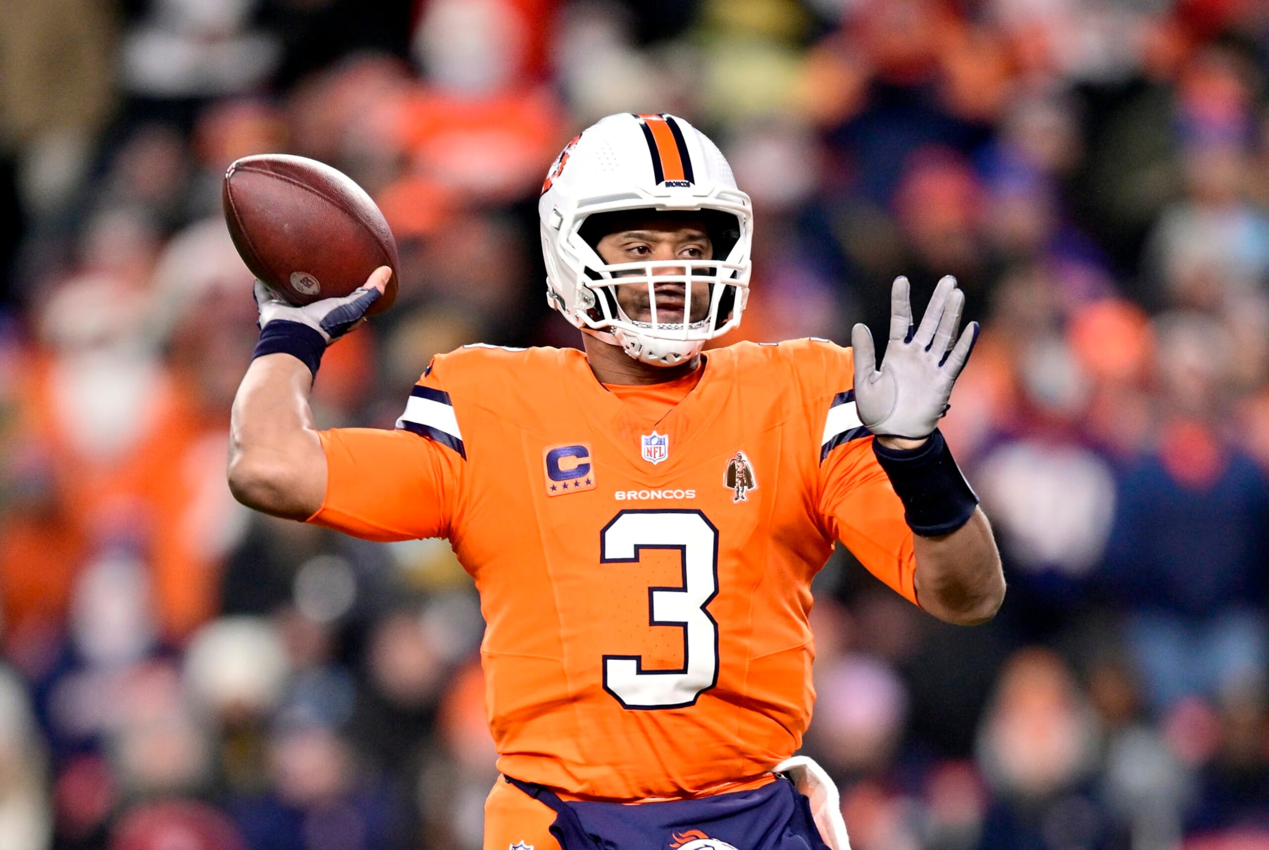 DENVER, COLORADO - DECEMBER 24:  Quarterback Russell Wilson #3 of the Denver Broncos passes during the 1st quarter of the game against the New England Patriots at Empower Field At Mile High on December 24, 2023 in Denver, Colorado. (Photo by Dustin Bradford/Getty Images)