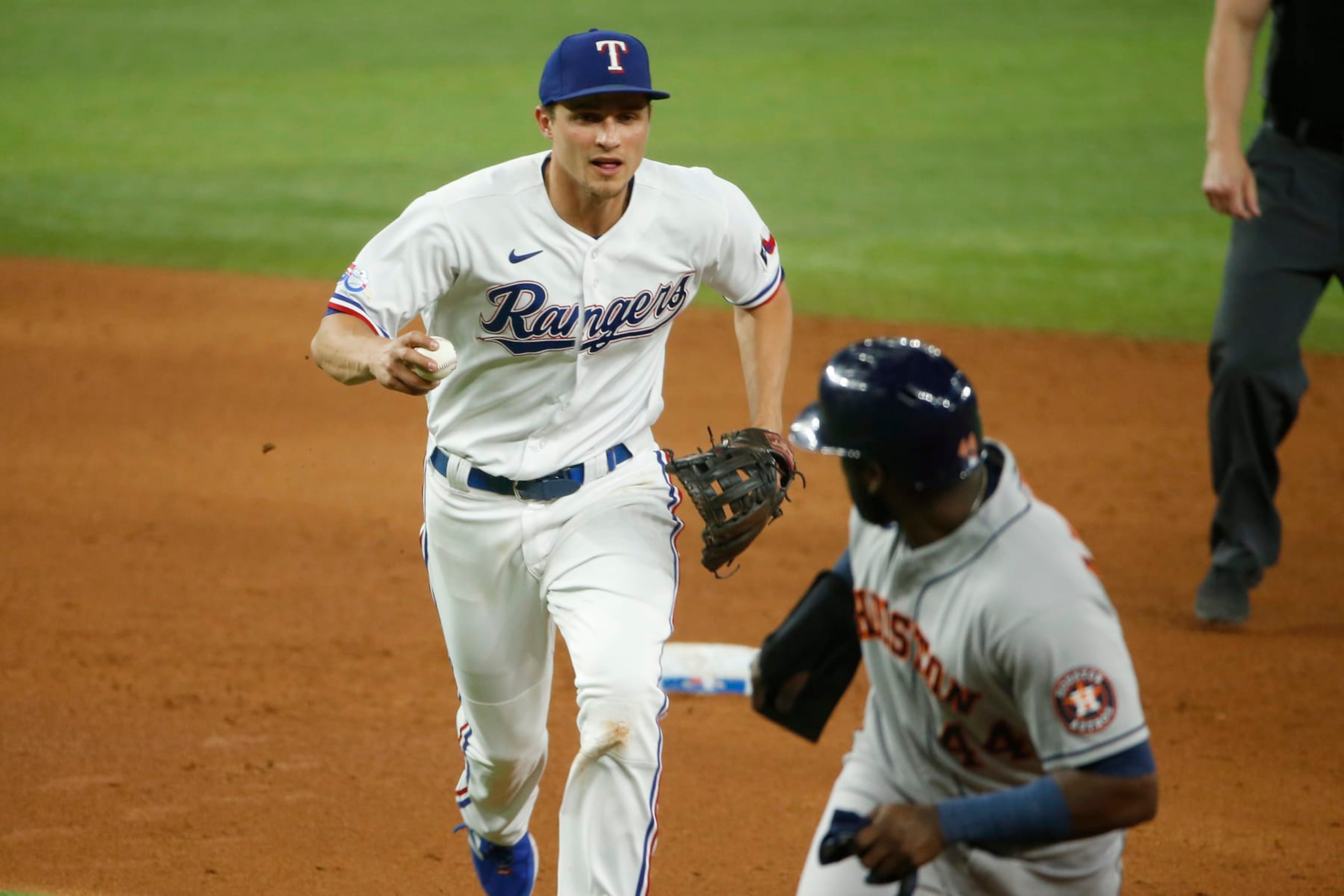 ARLINGTON, TEXAS - JUNE 14: Corey Seager #5 of the Texas Rangers catches Yordan Alvarez #44 of the Houston Astros in a rundown on a double play in the sixth inning at Globe Life Field on June 14, 2022 in Arlington, Texas. (Photo by Tim Heitman/Getty Images) ARLINGTON, TEXAS - JUNE 14: Corey Seager #5 of the Texas Rangers catches Yordan Alvarez #44 of the Houston Astros in a rundown on a double play in the sixth inning at Globe Life Field on June 14, 2022 in Arlington, Texas. (Photo by Tim Heitman/Getty Images)