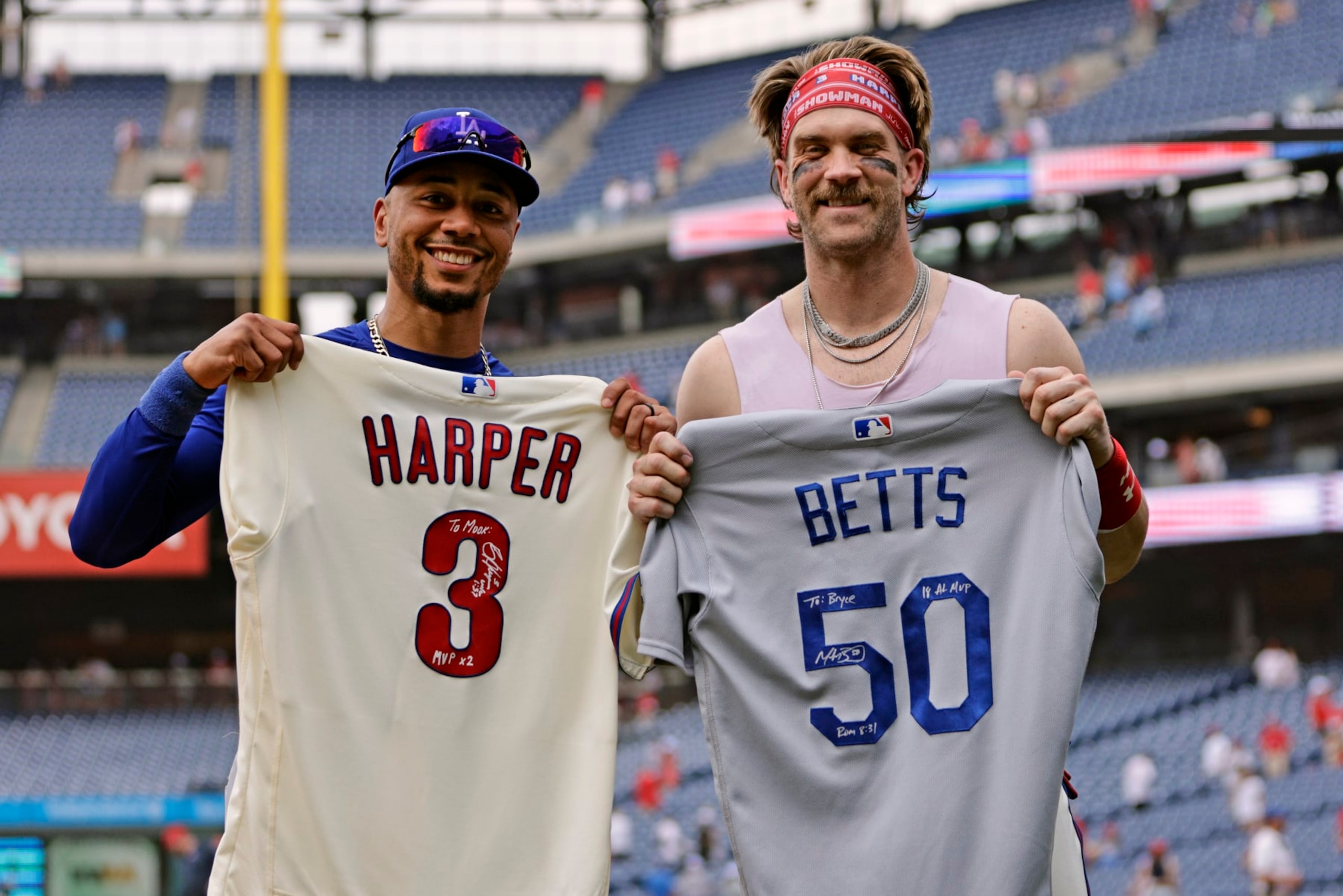PHILADELPHIA, PENNSYLVANIA - JUNE 11: Mookie Betts #50 of the Los Angeles Dodgers and Bryce Harper #3 of the Philadelphia Phillies exchange signed jerseys after their game at Citizens Bank Park on June 11, 2023 in Philadelphia, Pennsylvania. The Phillies defeated the Dodgers7-3. (Photo by Rich Schultz/Getty Images) PHILADELPHIA, PENNSYLVANIA - JUNE 11: Mookie Betts #50 of the Los Angeles Dodgers and Bryce Harper #3 of the Philadelphia Phillies exchange signed jerseys after their game at Citizens Bank Park on June 11, 2023 in Philadelphia, Pennsylvania. The Phillies defeated the Dodgers7-3. (Photo by Rich Schultz/Getty Images)
