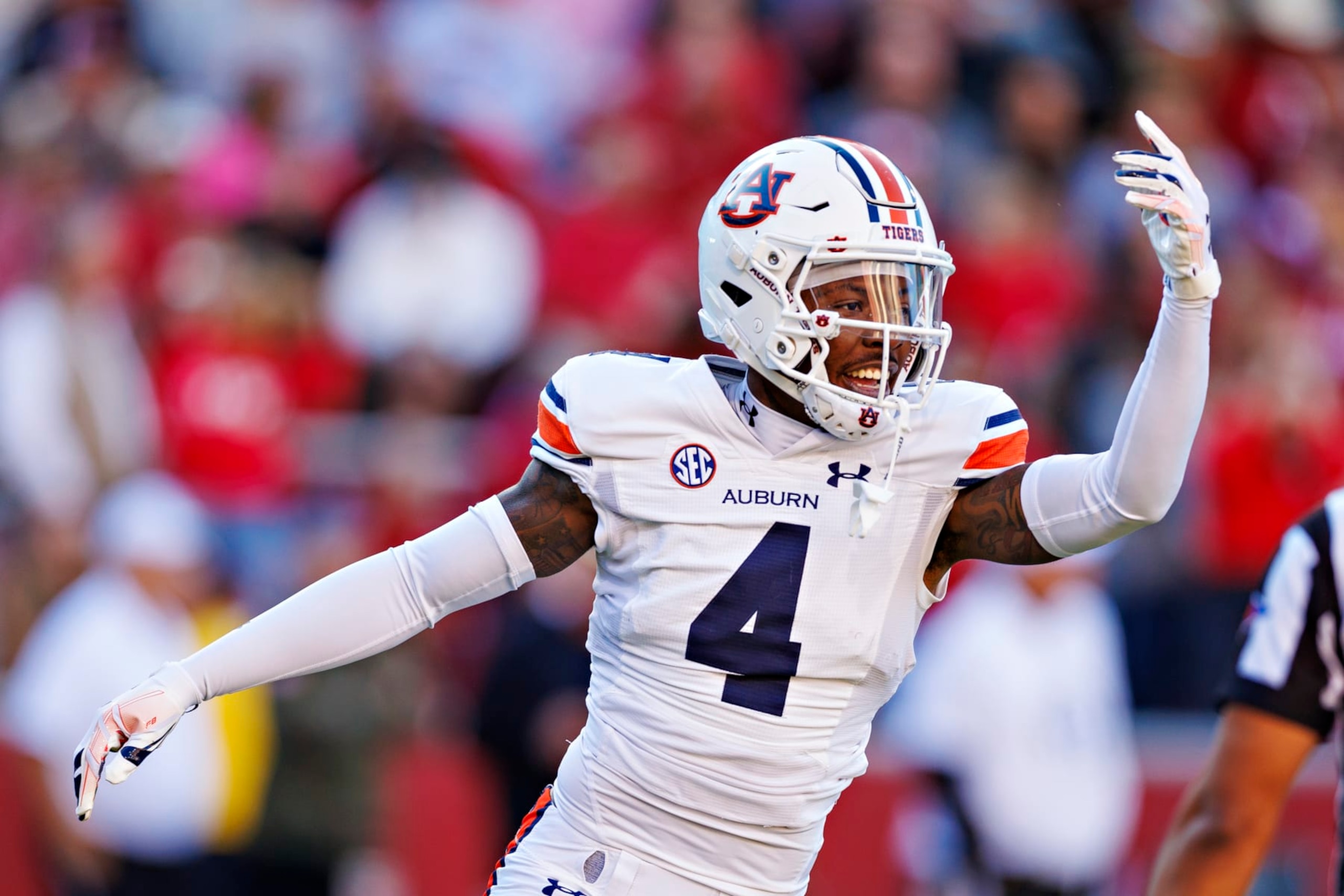 FAYETTEVILLE, ARKANSAS - NOVEMBER 11: D.J. James #4 of the Auburn Tigers celebrates after a big play during the game against the Arkansas Razorbacks at Donald W. Reynolds Razorback Stadium on November 11, 2023 in Fayetteville, Arkansas. The Tigers defeated the Razorbacks 48-10.  (Photo by Wesley Hitt/Getty Images)