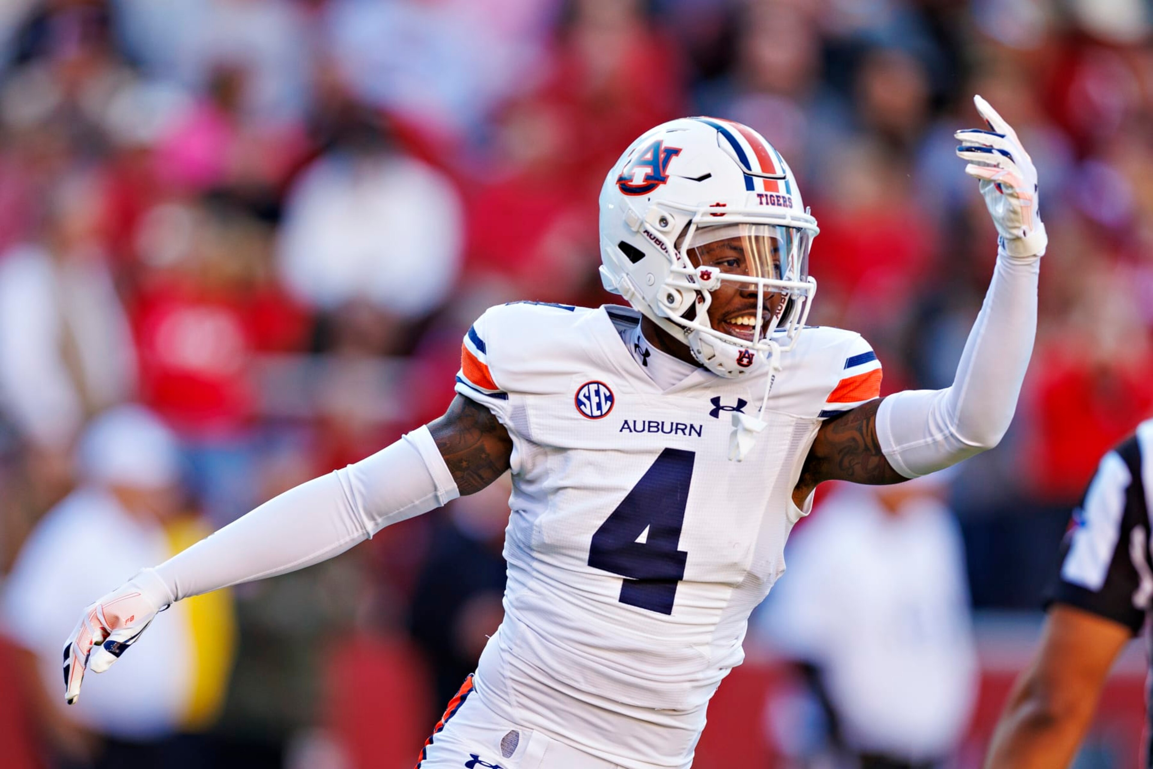 FAYETTEVILLE, ARKANSAS - NOVEMBER 11: D.J. James #4 of the Auburn Tigers celebrates after a big play during the game against the Arkansas Razorbacks at Donald W. Reynolds Razorback Stadium on November 11, 2023 in Fayetteville, Arkansas. The Tigers defeated the Razorbacks 48-10.  (Photo by Wesley Hitt/Getty Images)