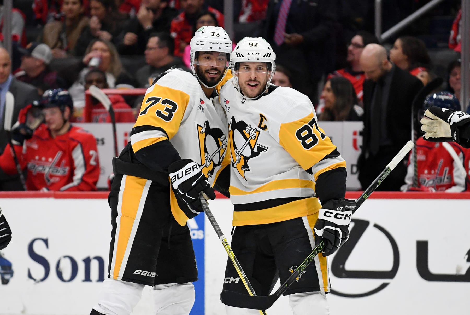 WASHINGTON, DC - APRIL 04: Penguins defenseman Pierre-Olivier Joseph (73) and center Sidney Crosby (87) celebrate after Joseph's first period goal during the Pittsburgh Penguins versus Washington Capitals National Hockey League game on April 4, 2024 at Capital One Arena in Washington, D.C.. (Photo by Randy Litzinger/Icon Sportswire via Getty Images)