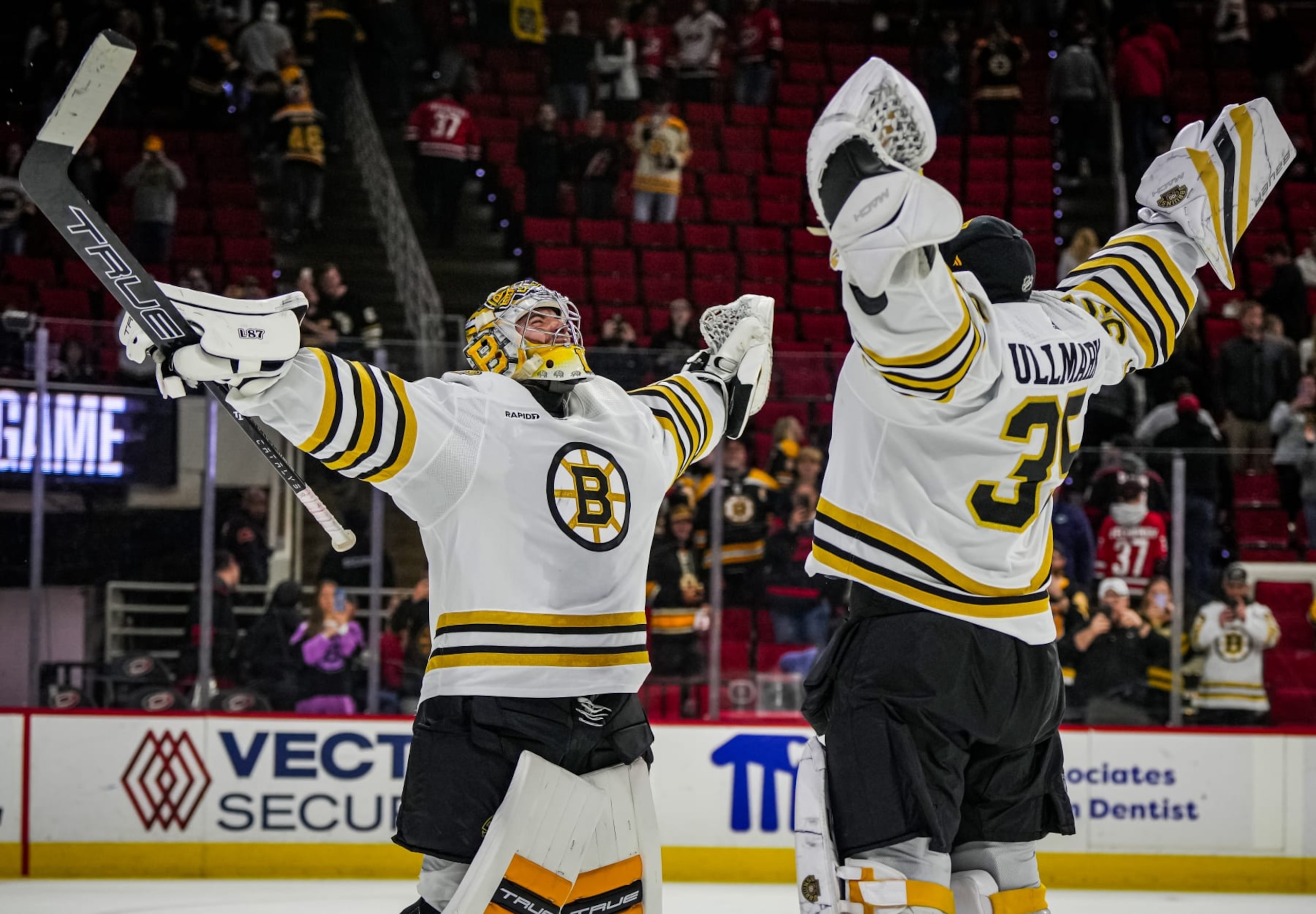 RALEIGH, NORTH CAROLINA - APRIL 04: Jeremy Swayman #1 of the Boston Bruins celebrates with Linus Ullmark #35 after a 4-1 victory against the Carolina Hurricanes at PNC Arena on April 4, 2024 in Raleigh, North Carolina. (Photo by Josh Lavallee/NHLI via Getty Images) RALEIGH, NORTH CAROLINA - APRIL 04: Jeremy Swayman #1 of the Boston Bruins celebrates with Linus Ullmark #35 after a 4-1 victory against the Carolina Hurricanes at PNC Arena on April 4, 2024 in Raleigh, North Carolina. (Photo by Josh Lavallee/NHLI via Getty Images)