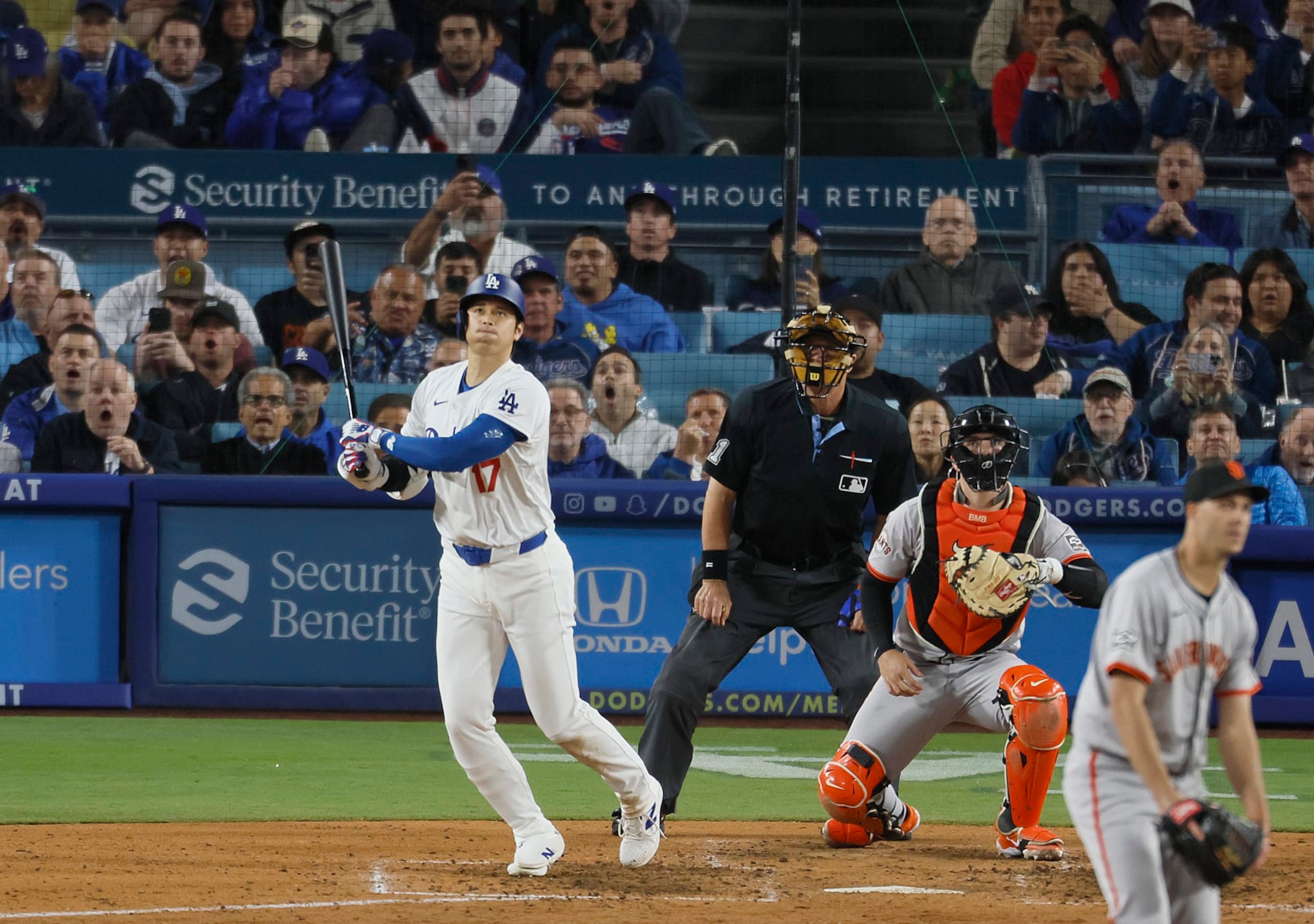Los Angeles, CA - April 03: Dodgers designated hitter Shohei Ohtani, #17, hits his first home run as a Dodger off of Giants pitcher Taylor Rogers, # 33, in the seventh inning at Dodger Stadium in Los Angeles Wednesday, April 3, 2024. (Allen J. Schaben / Los Angeles Times via Getty Images) Los Angeles, CA - April 03: Dodgers designated hitter Shohei Ohtani, #17, hits his first home run as a Dodger off of Giants pitcher Taylor Rogers, # 33, in the seventh inning at Dodger Stadium in Los Angeles Wednesday, April 3, 2024. (Allen J. Schaben / Los Angeles Times via Getty Images)