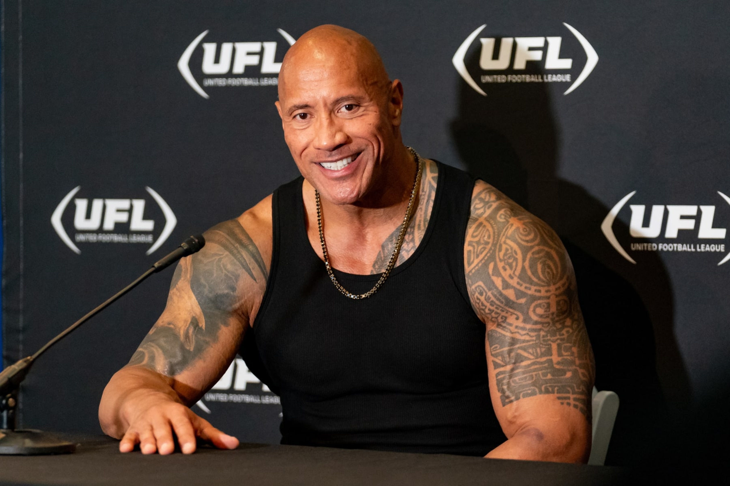 ARLINGTON, TX - MARCH 30:UFL owner Dwayne Johnson, The Rock, smiles during a press conference during a UFL game between the Birmingham Stallions and the Arlington Renegades on March 30, 2024 at Choctaw Stadium in Arlington, TX. (Photo by Chris Leduc/Icon Sportswire via Getty Images)
