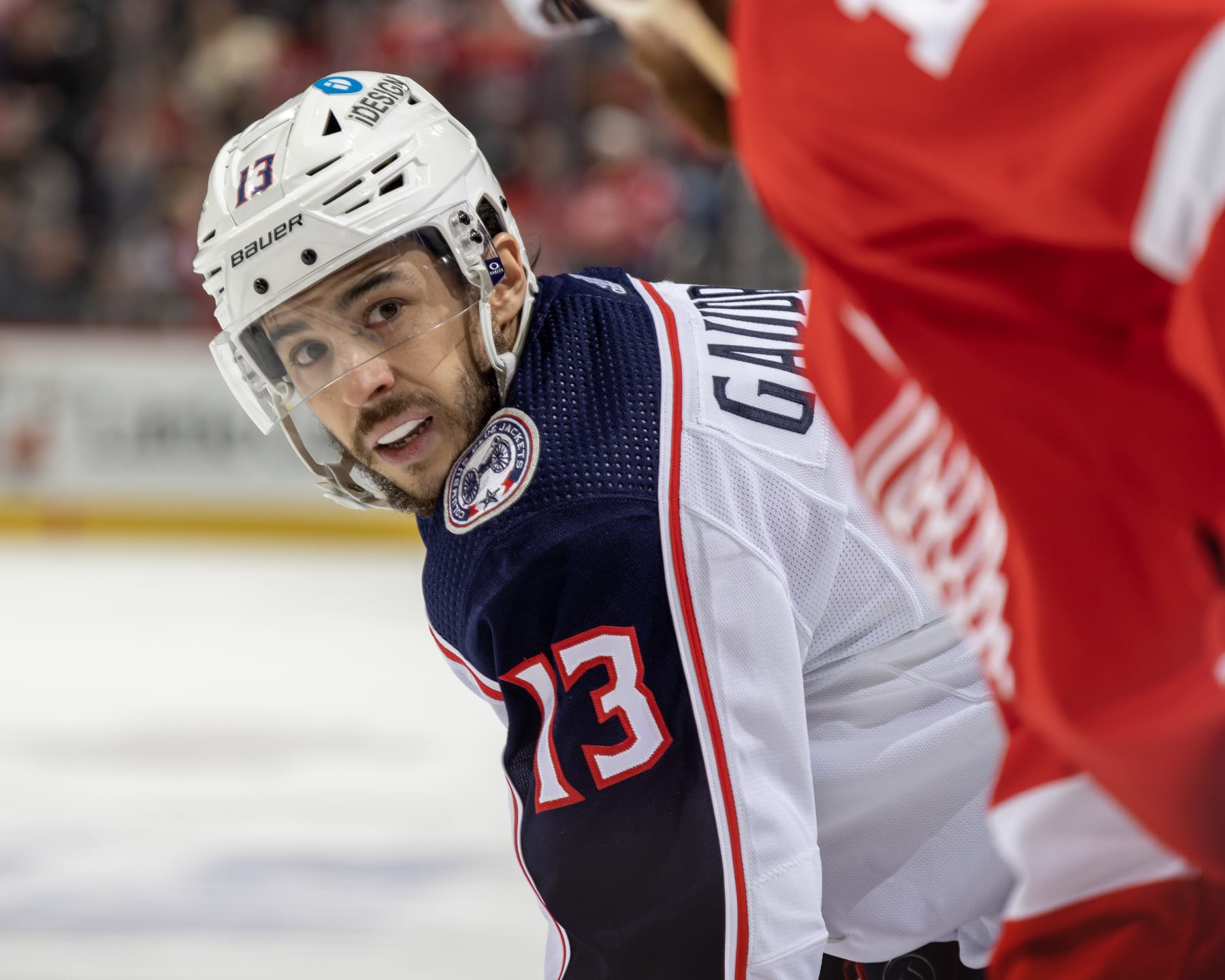 DETROIT, MI - JANUARY 14: Johnny Gaudreau #13 of the Columbus Blue Jackets gets set for the face-off against the Detroit Red Wings during the second period of an NHL game at Little Caesars Arena on January 14, 2023 in Detroit, Michigan. (Photo by Dave Reginek/NHLI via Getty Images)