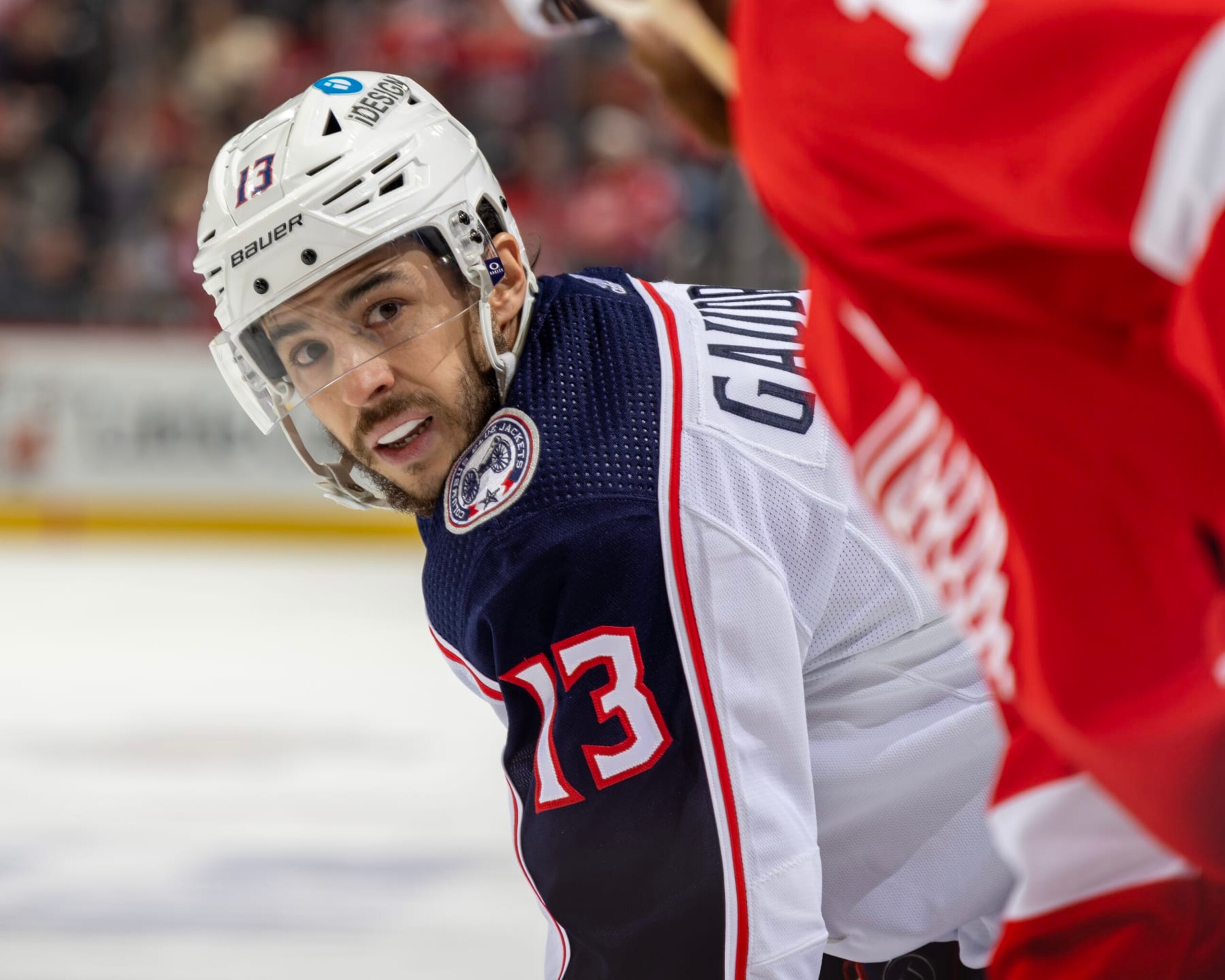 DETROIT, MI - JANUARY 14: Johnny Gaudreau #13 of the Columbus Blue Jackets gets set for the face-off against the Detroit Red Wings during the second period of an NHL game at Little Caesars Arena on January 14, 2023 in Detroit, Michigan. (Photo by Dave Reginek/NHLI via Getty Images)