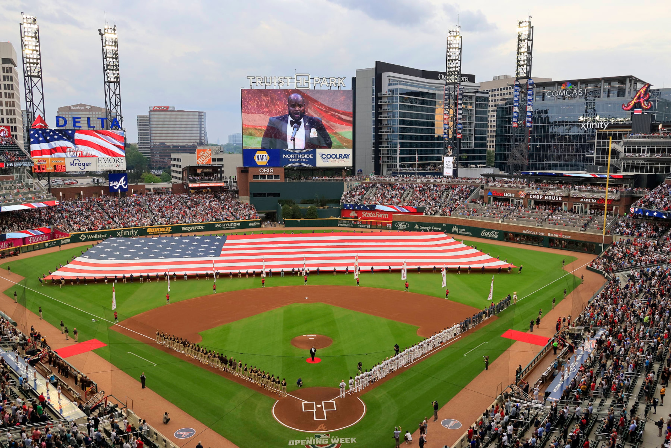 ATLANTA, GA - APRIL 06: The National Anthem is sung by Timothy Miller before the Braves 2023 home opener MLB game between the Atlanta Braves and the San Diego Padres on April 6, 2023 at Truist Park in Atlanta, Georgia.  (Photo by David J. Griffin/Icon Sportswire via Getty Images)