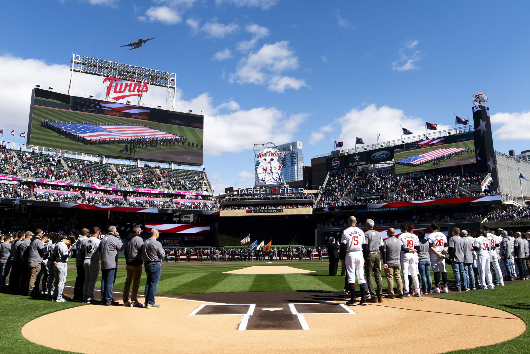 MINNEAPOLIS, MINNESOTA - APRIL 4: Members of the Minnesota Twins line up for the national anthem before the home opener at Target Field on April 4, 2024 in Minneapolis, Minnesota. (Photo by Stephen Maturen/Getty Images)