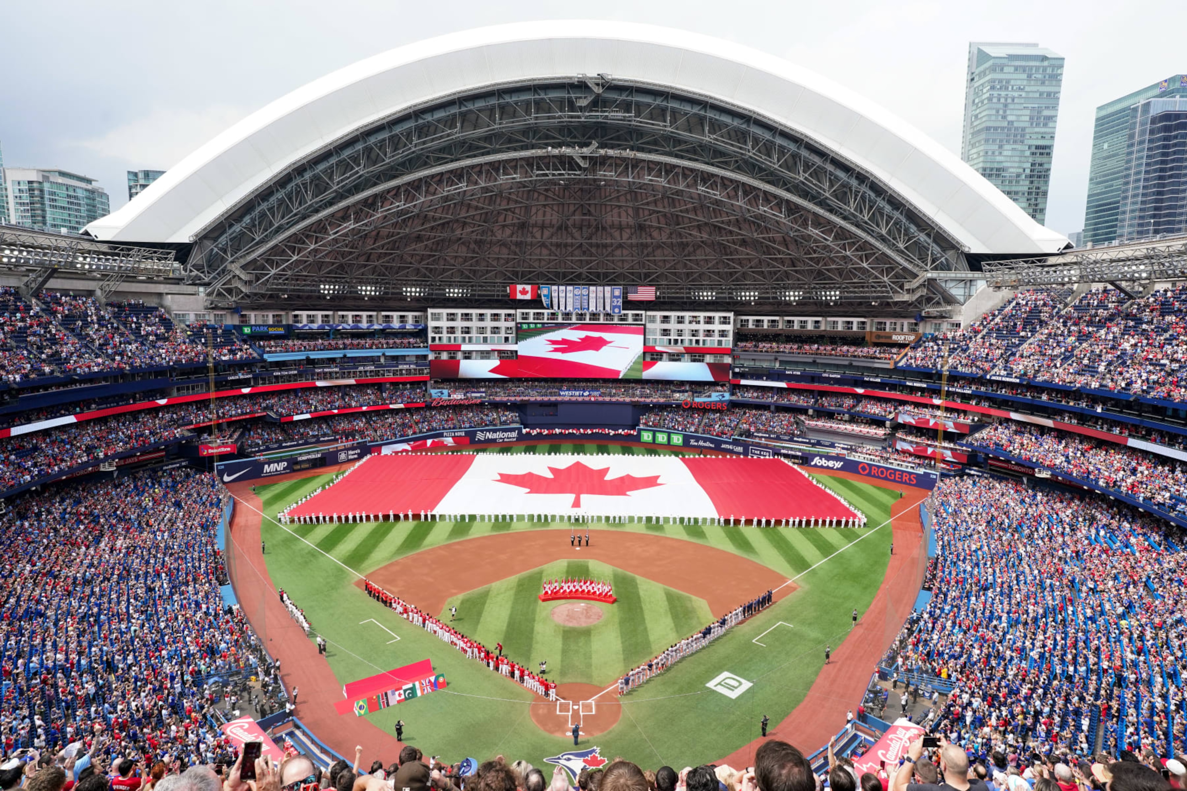 TORONTO, - JULY 01: A general view of the field during the national anthem on Canada Day prior to the game between the Boston Red Sox and the Toronto Blue Jays at Rogers Centre on Saturday, July 1, 2023 in Toronto, Canada. (Photo by Thomas Skrlj/MLB Photos via Getty Images) TORONTO, - JULY 01: A general view of the field during the national anthem on Canada Day prior to the game between the Boston Red Sox and the Toronto Blue Jays at Rogers Centre on Saturday, July 1, 2023 in Toronto, Canada. (Photo by Thomas Skrlj/MLB Photos via Getty Images)