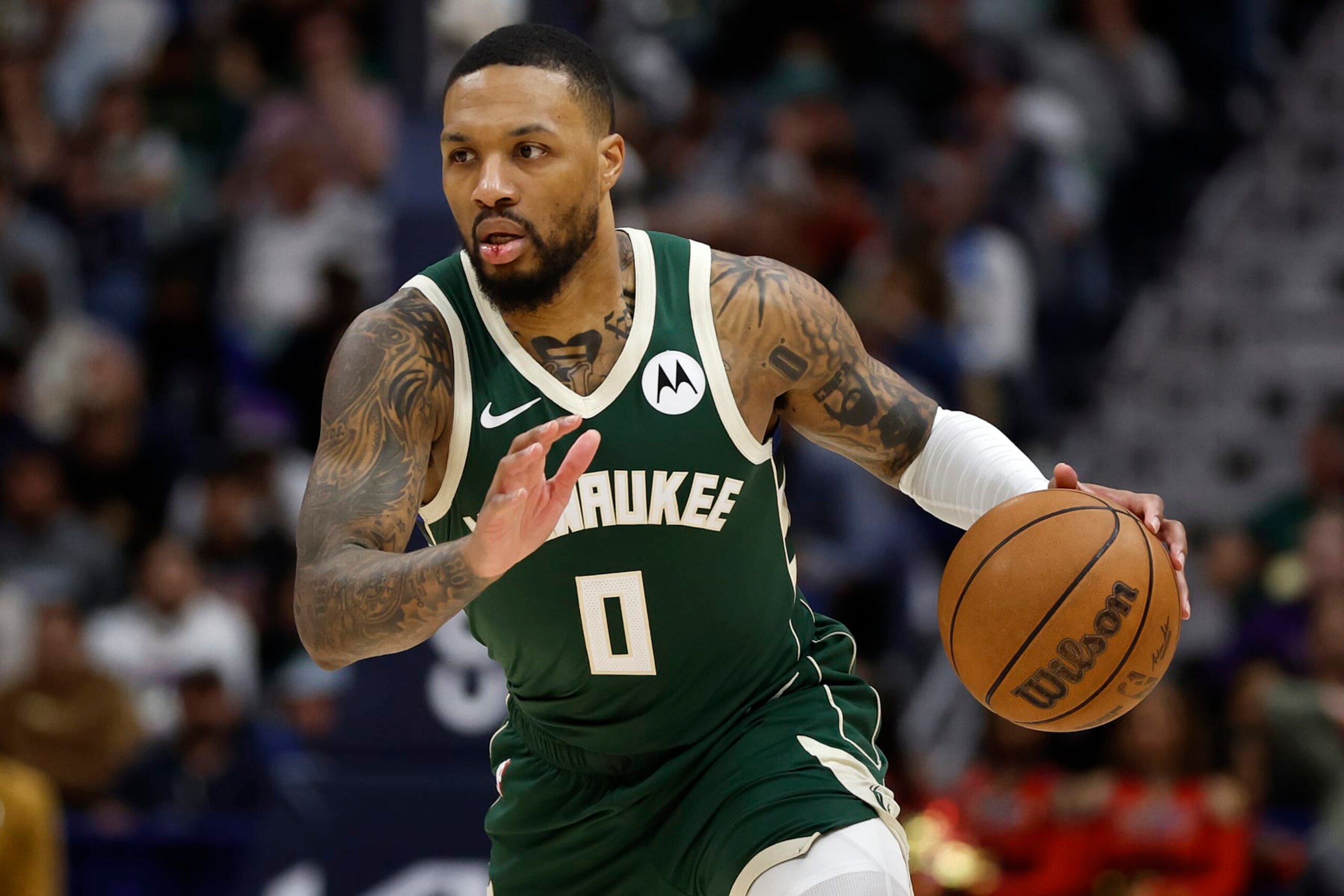 NEW ORLEANS, LOUISIANA - MARCH 28: Damian Lillard #0 of the Milwaukee Bucks drives the ball up the court against the New Orleans Pelicans at Smoothie King Center on March 28, 2024 in New Orleans, Louisiana. (Photo by Chris Graythen/Getty Images)