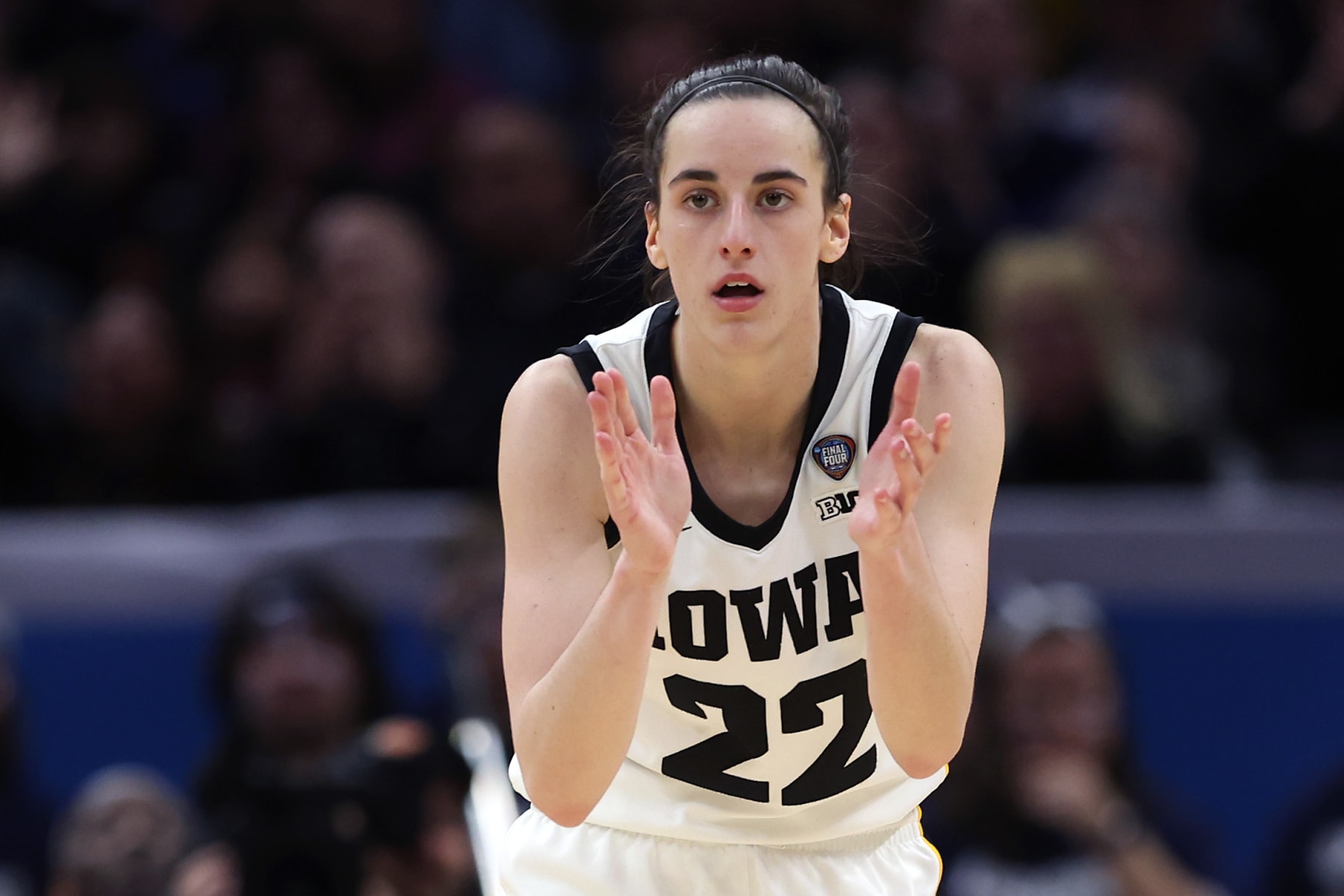 CLEVELAND, OHIO - APRIL 05: Caitlin Clark #22 of the Iowa Hawkeyes reacts in the second half during the NCAA Women's Basketball Tournament Final Four semifinal game against the UConn Huskies at Rocket Mortgage Fieldhouse on April 05, 2024 in Cleveland, Ohio. (Photo by Steph Chambers/Getty Images)
