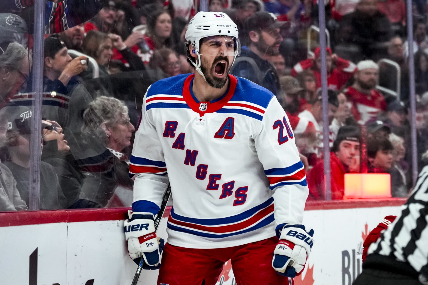 DETROIT, MICHIGAN - APRIL 05: Chris Kreider #20 of the New York Rangers reacts after scoring a goal against the Detroit Red Wings during the third period at Little Caesars Arena on April 05, 2024 in Detroit, Michigan. (Photo by Nic Antaya/Getty Images)
