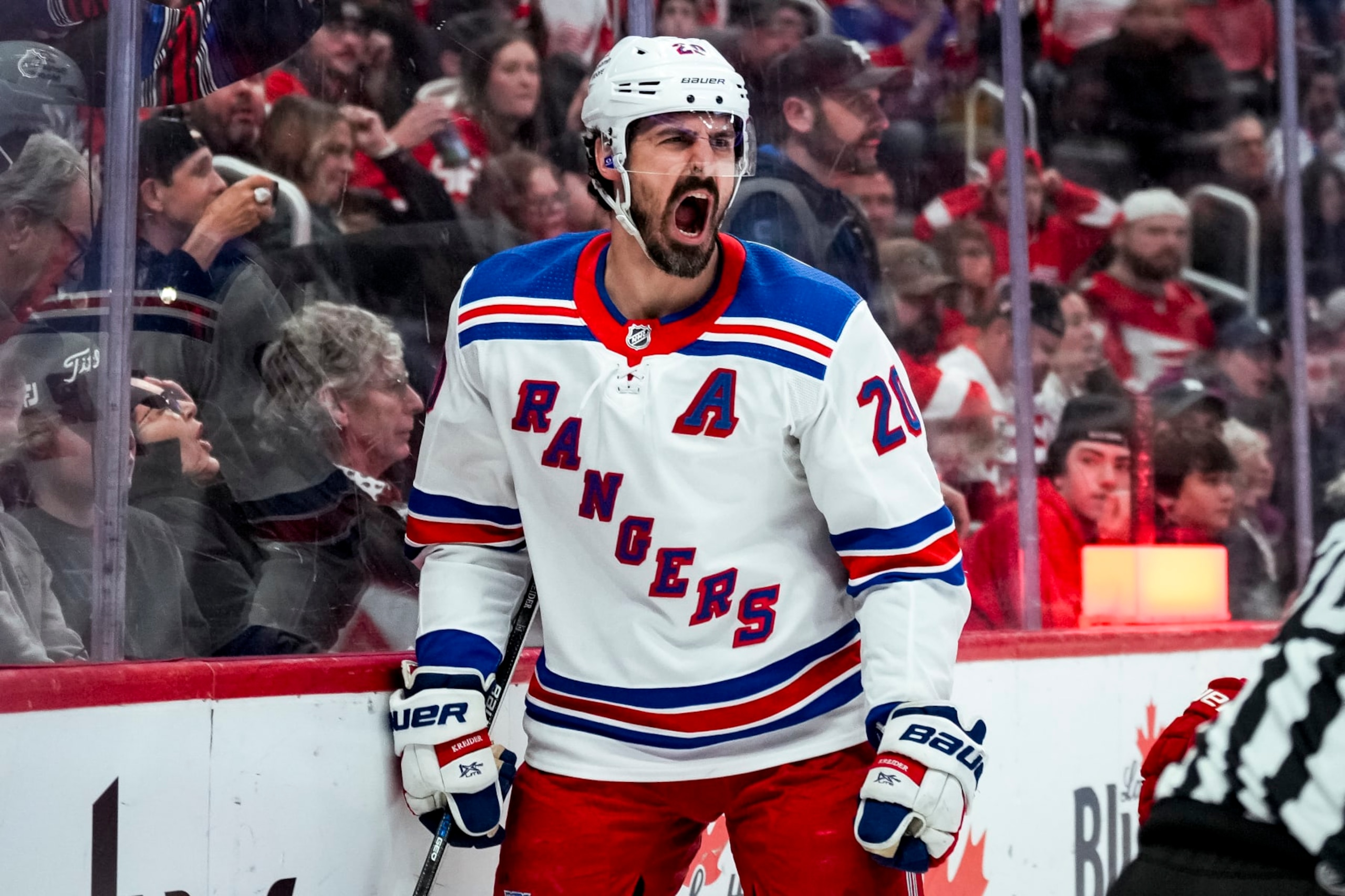 DETROIT, MICHIGAN - APRIL 05: Chris Kreider #20 of the New York Rangers reacts after scoring a goal against the Detroit Red Wings during the third period at Little Caesars Arena on April 05, 2024 in Detroit, Michigan. (Photo by Nic Antaya/Getty Images)