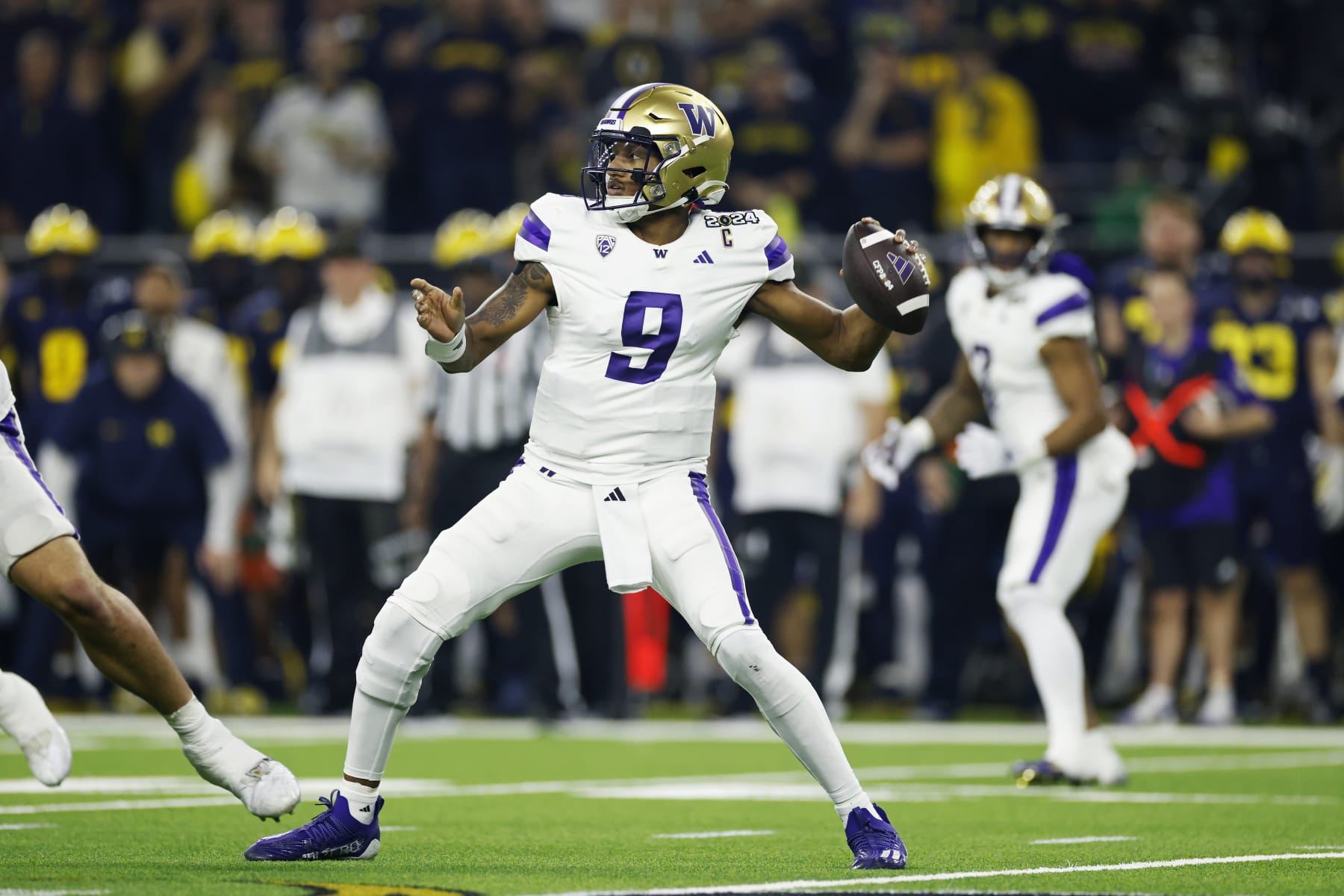 HOUSTON, TX - JANUARY 08: Washington Huskies quarterback Michael Penix Jr. (9) passes the ball during the CFP National Championship against the Michigan Wolverines on January 08, 2024 at NRG Stadium in Houston, Texas. (Photo by Joe Robbins/Icon Sportswire via Getty Images)