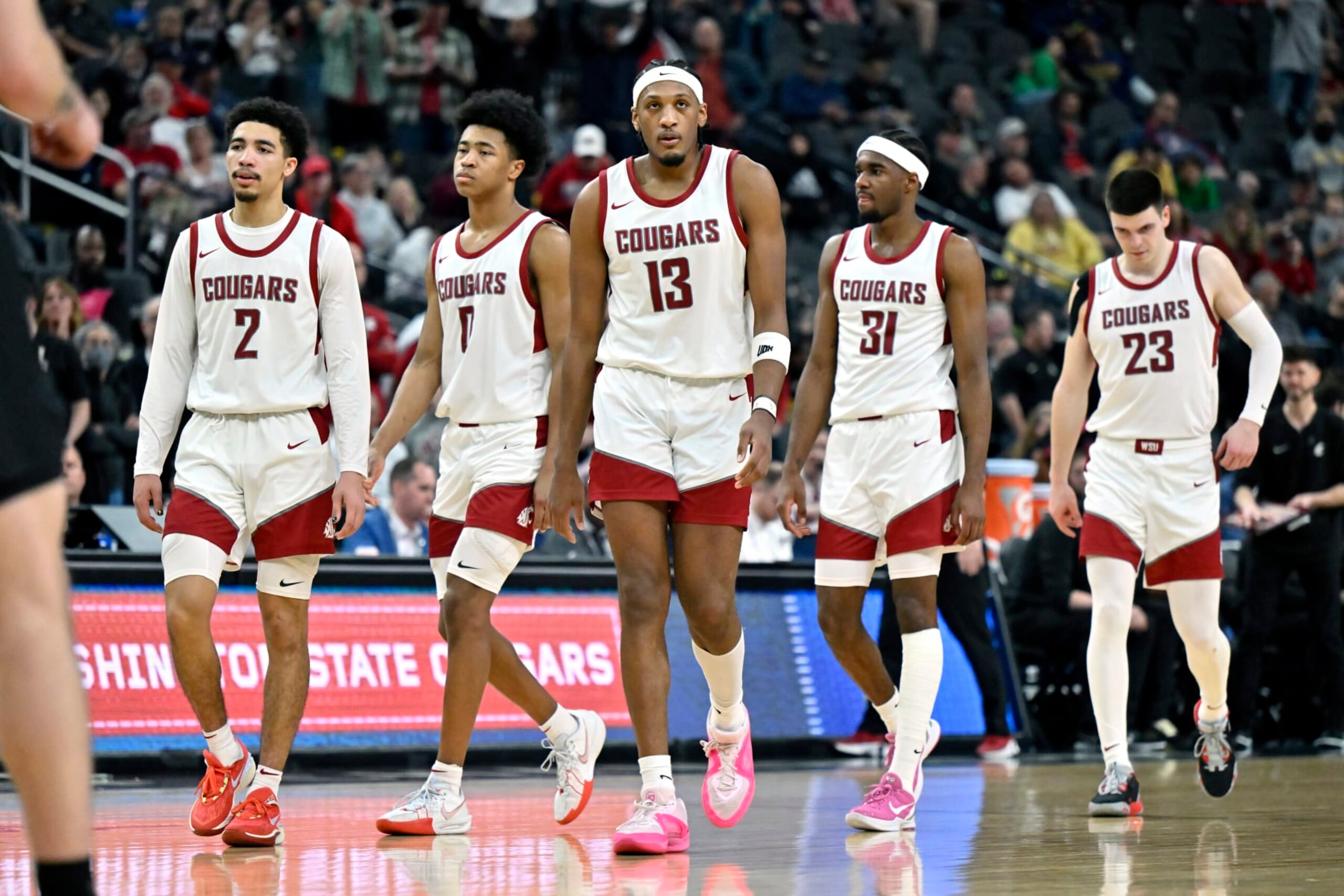 LAS VEGAS, NEVADA - MARCH 15: Myles Rice #2, Jaylen Wells #0, Isaac Jones #13, Kymany Houinsou #31 and Andrej Jakimovski #23 of the Washington State Cougars walk on the court after a timeout against the Colorado Buffaloes in the second half of a semifinal game during the the Pac-12 Conference basketball tournament at T-Mobile Arena on March 15, 2024 in Las Vegas, Nevada. The Buffaloes defeated the Cougars 58-52. (Photo by David Becker/Getty Images)