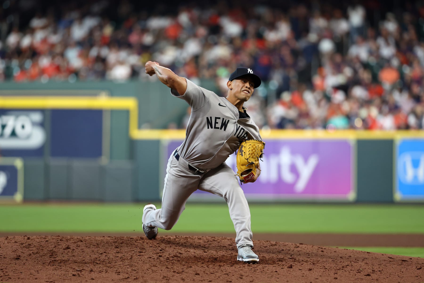HOUSTON, TEXAS - MARCH 28: Jonathan Loáisiga #43 of the New York Yankees pitches during the Opening Day game against the Houston Astros at Minute Maid Park on March 28, 2024 in Houston, Texas. (Photo by New York Yankees/Getty Images)