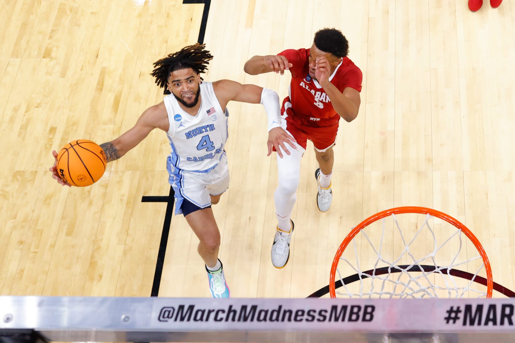 LOS ANGELES, CALIFORNIA - MARCH 28: RJ Davis #4 of the North Carolina Tar Heels lays it up against the Alabama Crimson Tide during the Sweet Sixteen round of the 2024 NCAA Men's Basketball Tournament held at Crypto.com Arena on March 28, 2024 in Los Angeles, California. (Photo by C. Morgan Engel/NCAA Photos via Getty Images)