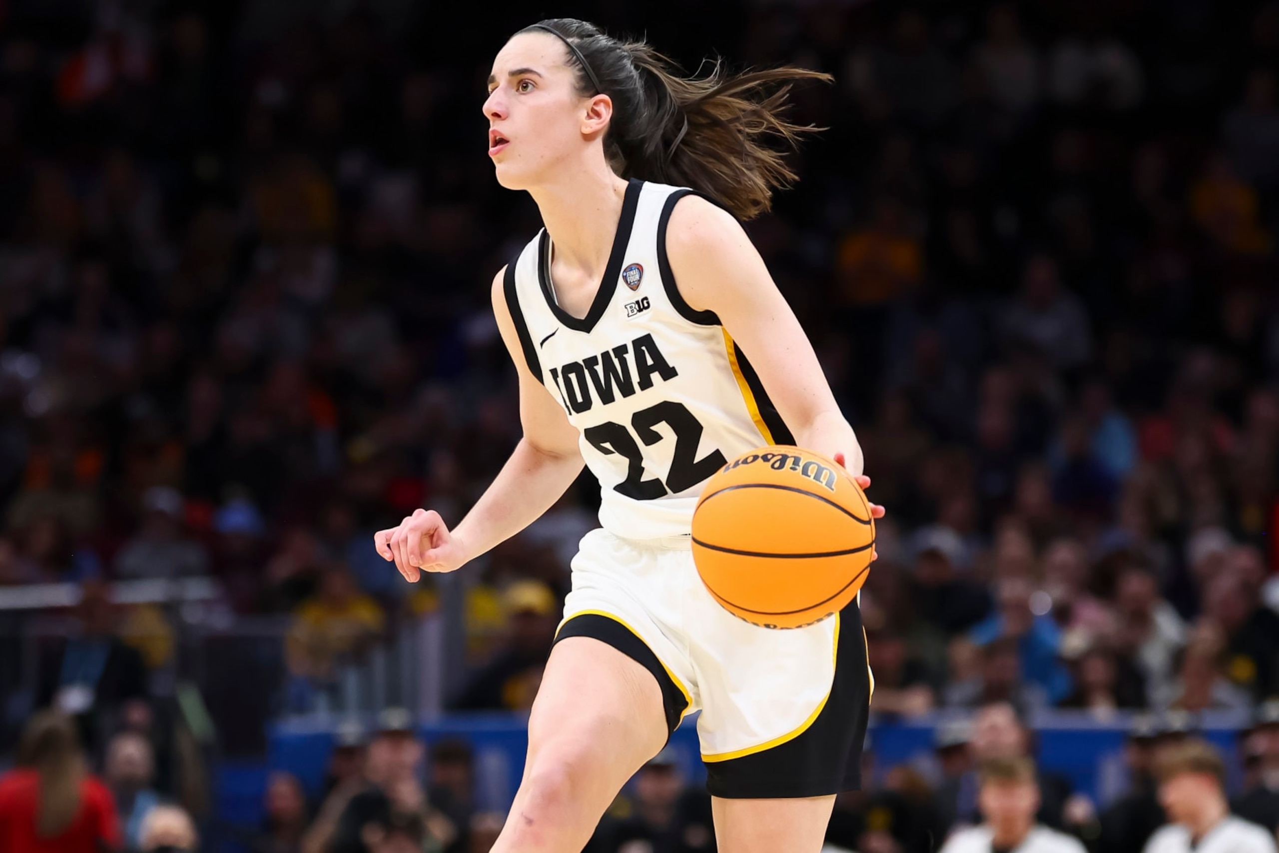 CLEVELAND, OHIO - APRIL 5: Caitlin Clark #22 of the Iowa Hawkeyes dribbles against the UConn Huskies during the NCAA Women's Basketball Tournament Final Four semifinal game at Rocket Mortgage Fieldhouse on April 5, 2024 in Cleveland, Ohio. (Photo by C. Morgan Engel/NCAA Photos via Getty Images)