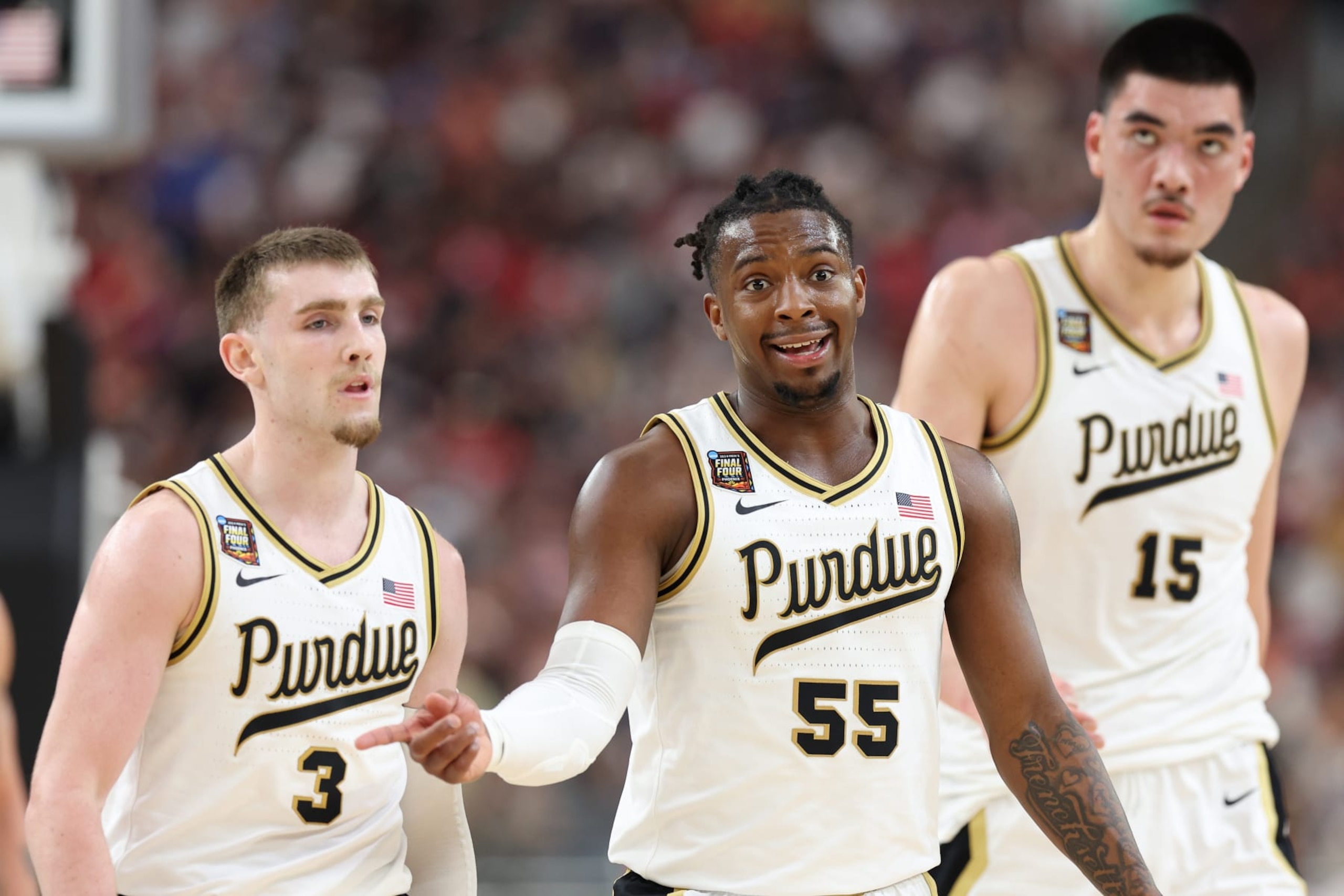GLENDALE, ARIZONA - APRIL 06: Braden Smith #3, Lance Jones #55, and Zach Edey #15 of the Purdue Boilermakers walk across the court in the first half against the North Carolina State Wolfpack in the NCAA Men's Basketball Tournament Final Four semifinal game at State Farm Stadium on April 06, 2024 in Glendale, Arizona. (Photo by Jamie Squire/Getty Images)
