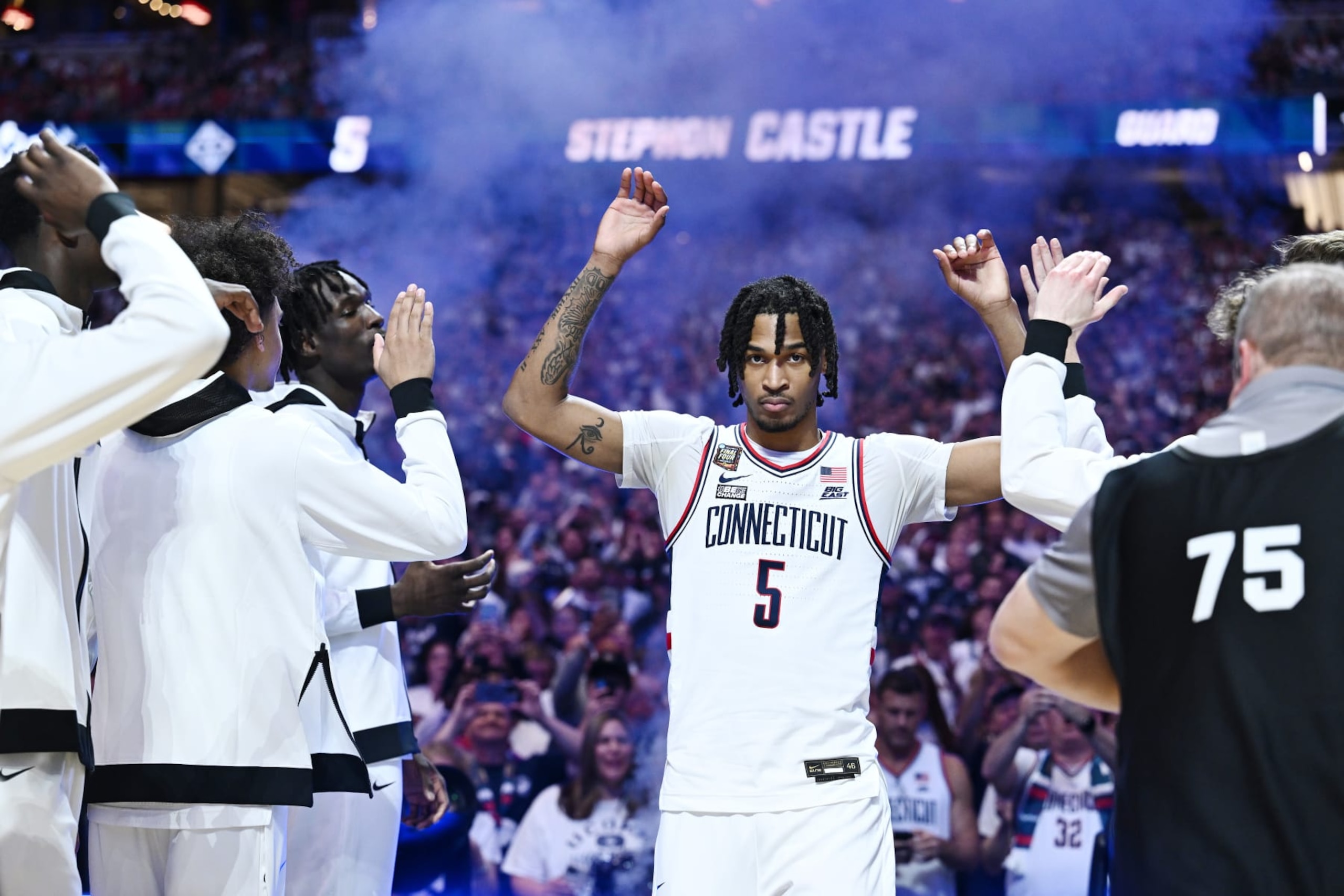 GLENDALE, ARIZONA - APRIL 06: Stephon Castle #5 of the Connecticut Huskies high fives teammates prior to the first half in the NCAA Men’s Basketball Tournament Final Four semifinal game at State Farm Stadium on April 06, 2024 in Glendale, Arizona. (Photo by Brett Wilhelm/NCAA Photos via Getty Images)