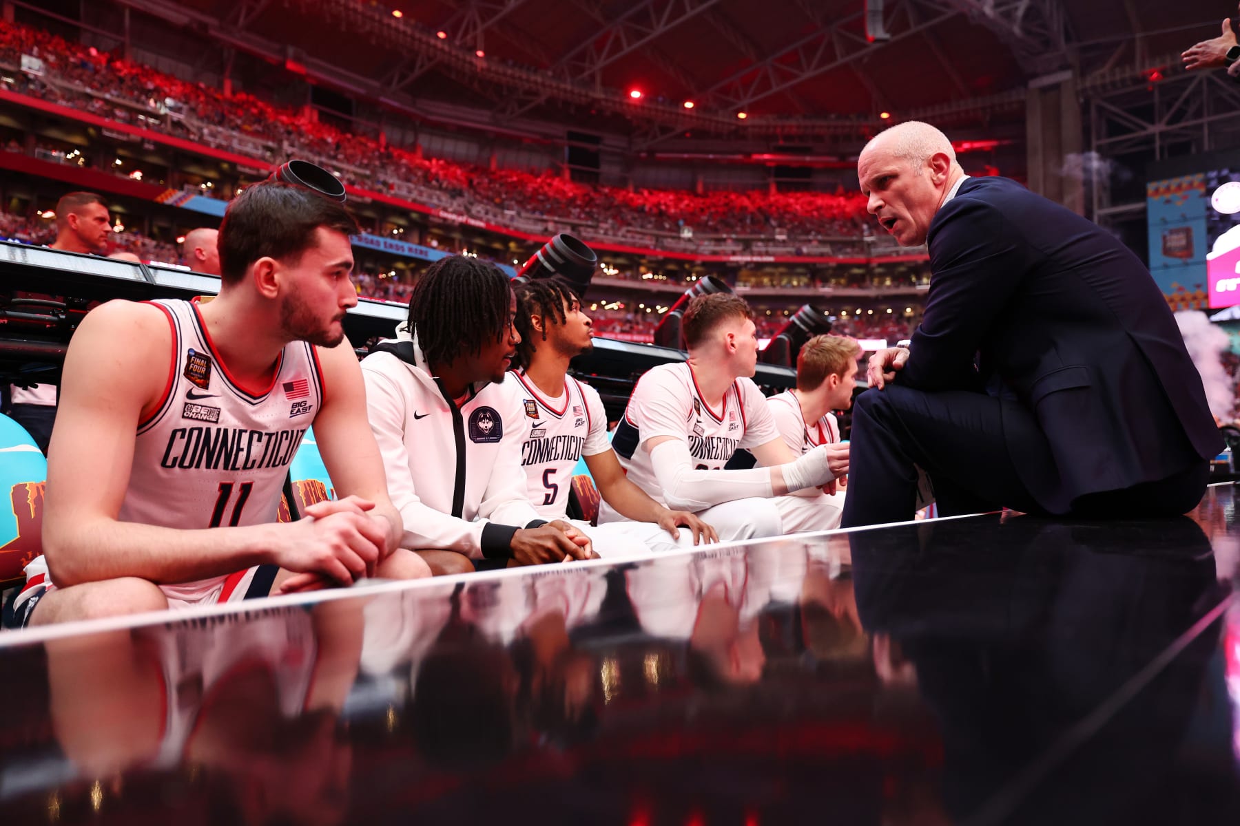 GLENDALE, ARIZONA - APRIL 06: Head coach Dan Hurley of the Connecticut Huskies talks to team during player introductions before in the NCAA Men’s Basketball Tournament Final Four semifinal game against the Alabama Crimson Tide at State Farm Stadium on April 06, 2024 in Glendale, Arizona. (Photo by Jamie Schwaberow/NCAA Photos via Getty Images)