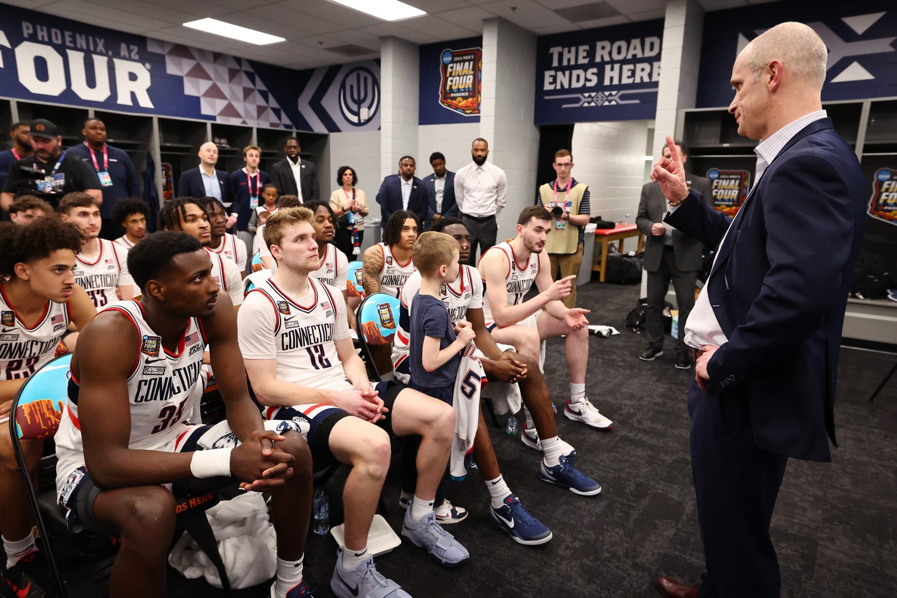 GLENDALE, ARIZONA - APRIL 06: Head coach Dan Hurley of the Connecticut Huskies talks to team in the locker room after defeating the Alabama Crimson Tide in the NCAA Men’s Basketball Tournament Final Four semifinal game at State Farm Stadium on April 06, 2024 in Glendale, Arizona. (Photo by Jamie Schwaberow/NCAA Photos via Getty Images)